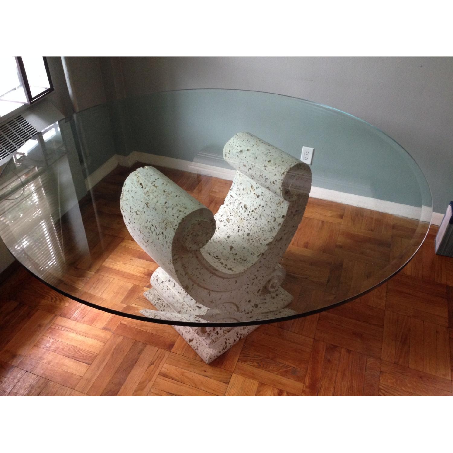 Dining room table hand carved coral stone base and glass top AptDeco