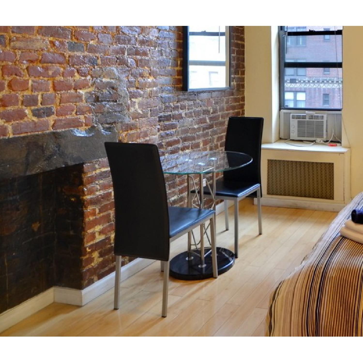 Glass Breakfast Table & Leather Chairs AptDeco