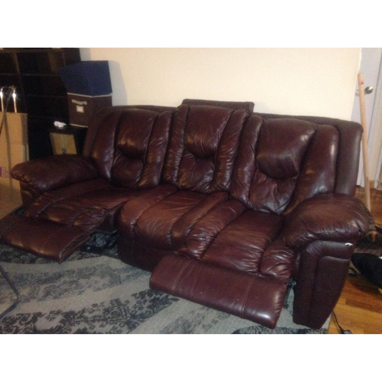 Ashley's Brown Leather Reclining Sofa - image-1