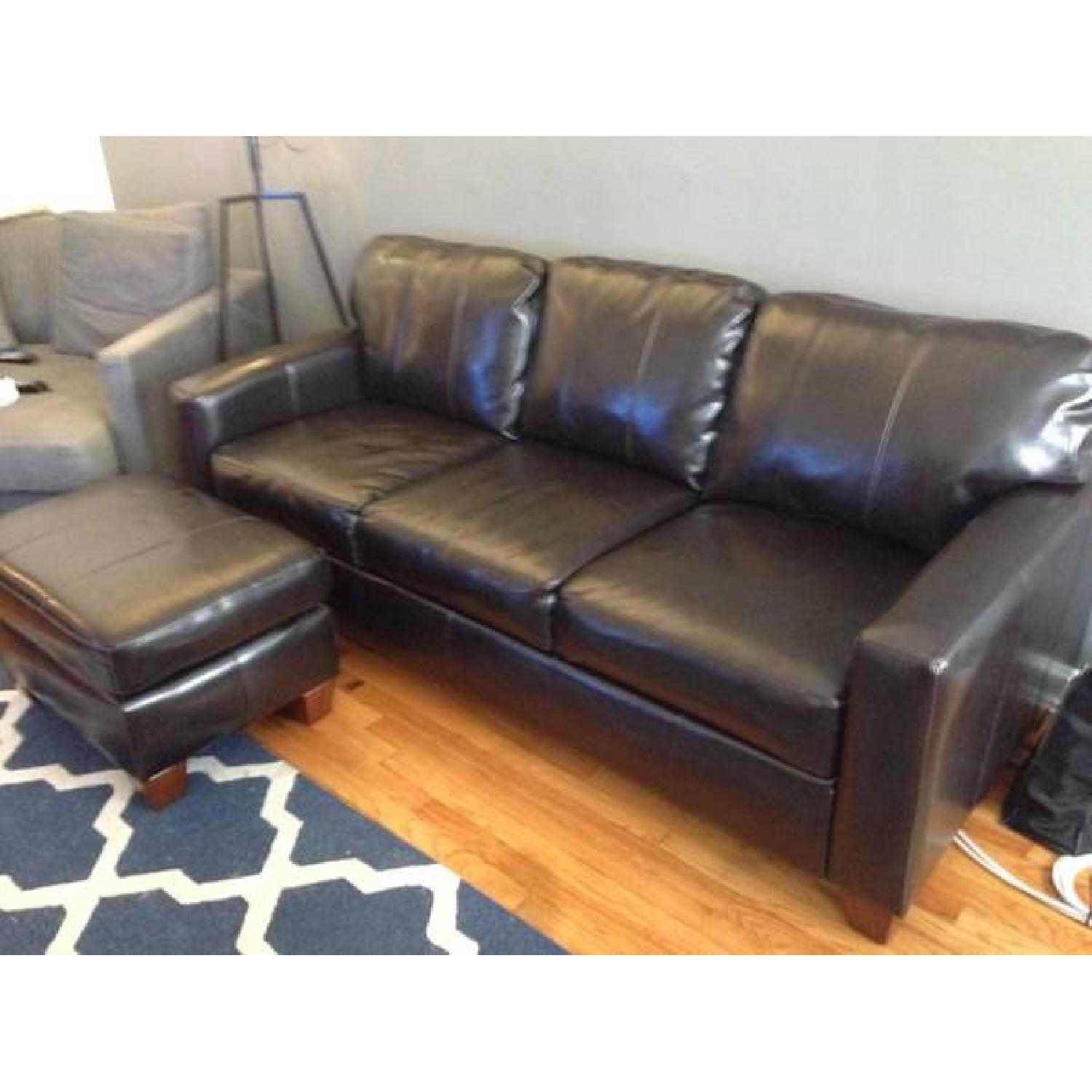 Jennifer Convertibles Leather Couch + Ottoman - image-1