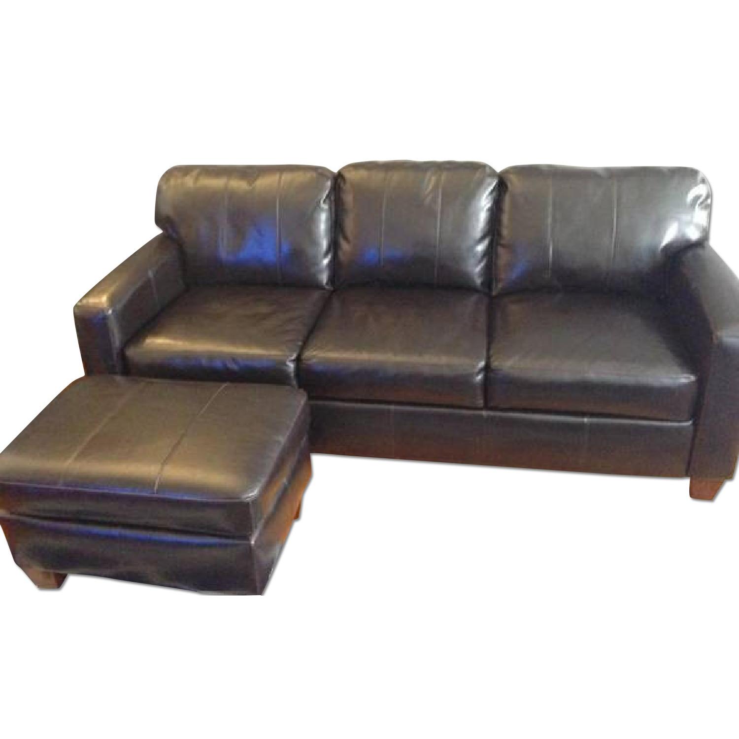 Jennifer Convertibles Leather Couch + Ottoman - image-0