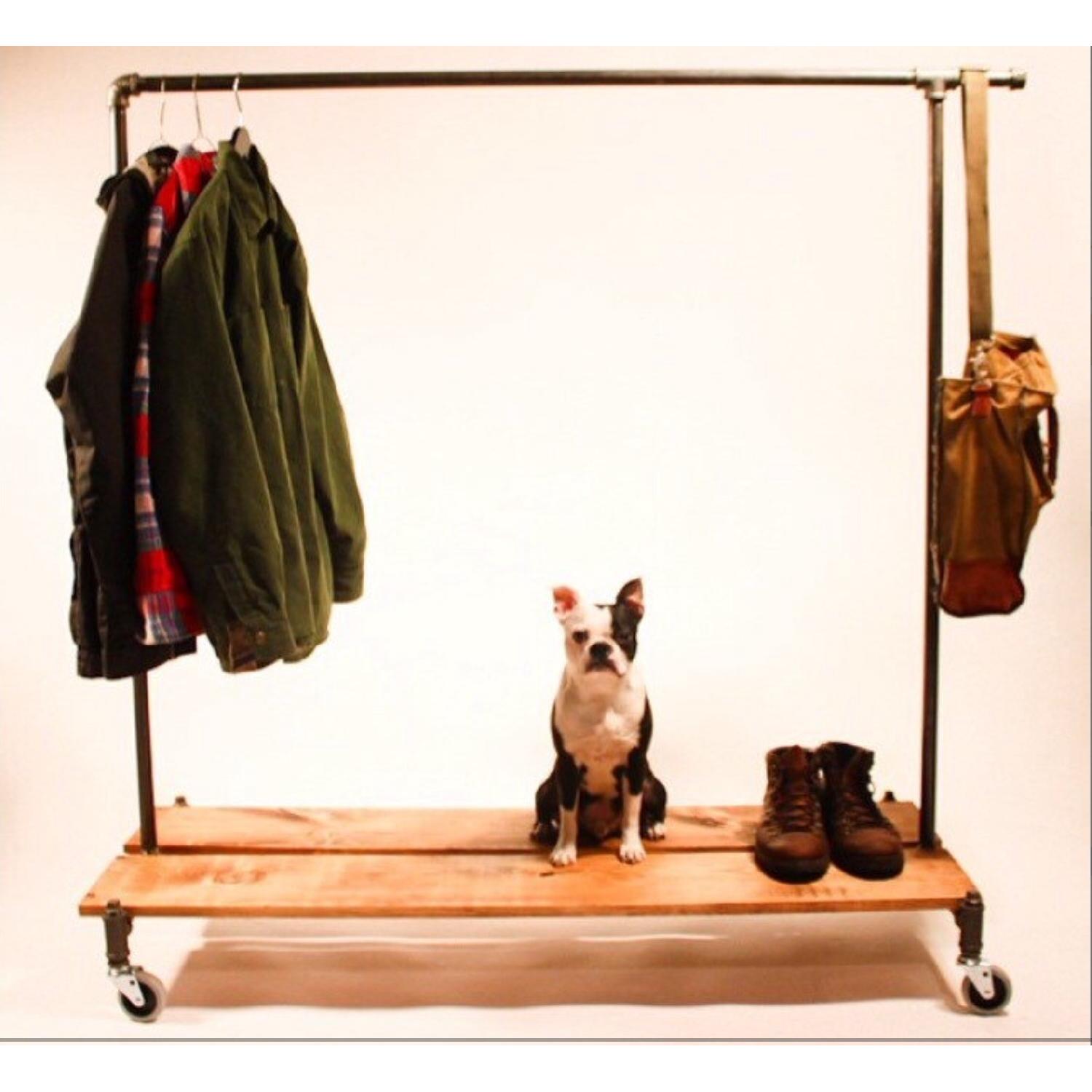 Cast Iron Clothing Rack w/ Wheels AptDeco