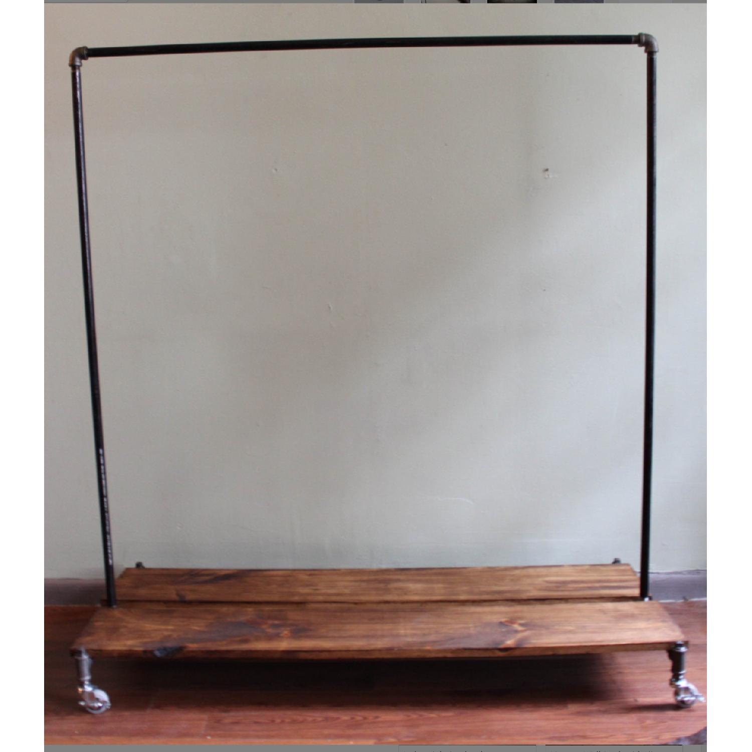 Cast Iron Clothing Rack w/ Wheels AptDeco