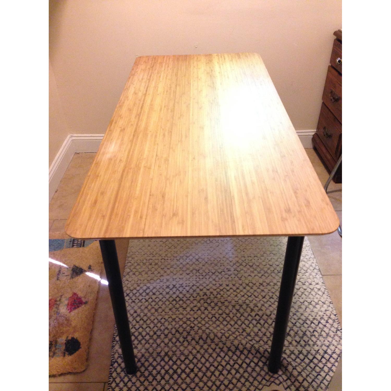 Ikea Hilver Bamboo Table w/ Black Metal Adjustable legs - AptDeco