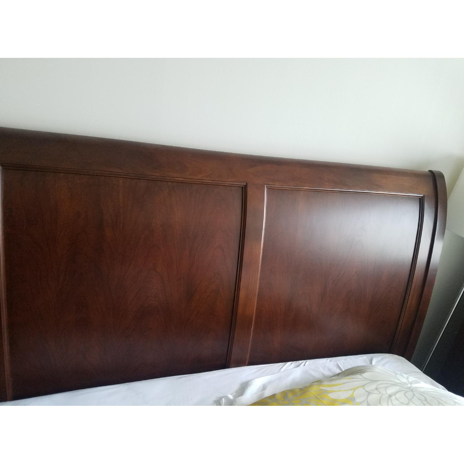 Raymour & Flanigan Queens Size Cherry Wood Bed Frame AptDeco