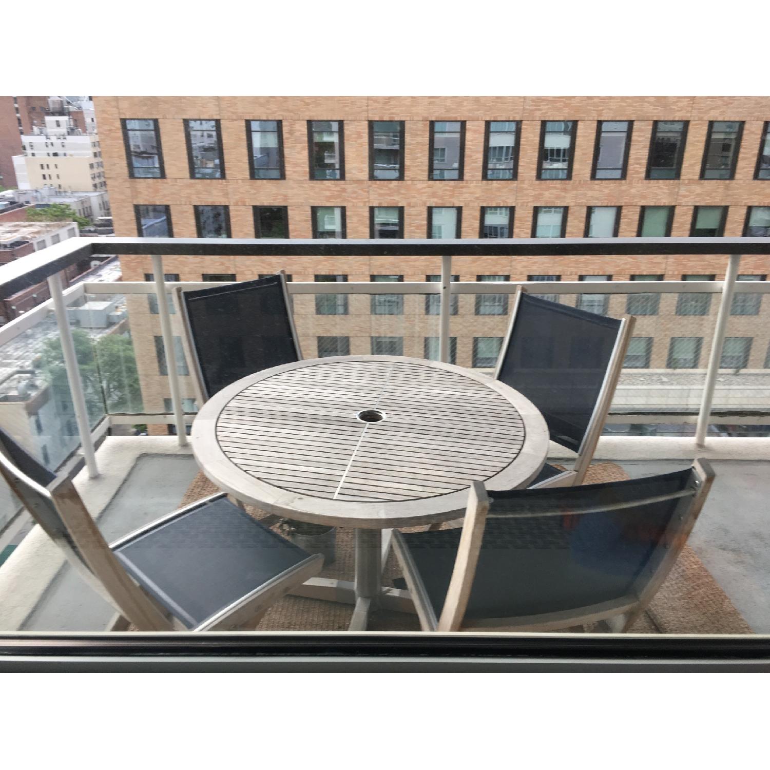 Gloster Patio Table w/ 4 Solana Folding Chairs AptDeco