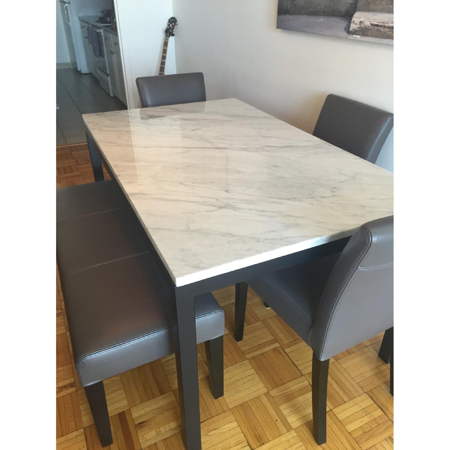 Crate & Barrel Marble Top Parsons Dining Table - AptDeco