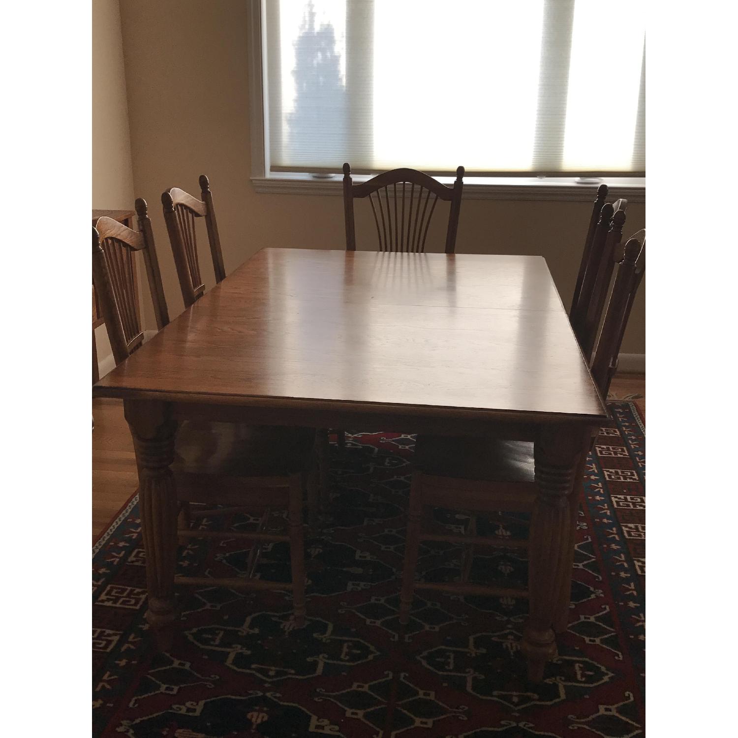 Solid Oak Dining Table w/ 6 Solid Oak Dining Chairs - AptDeco