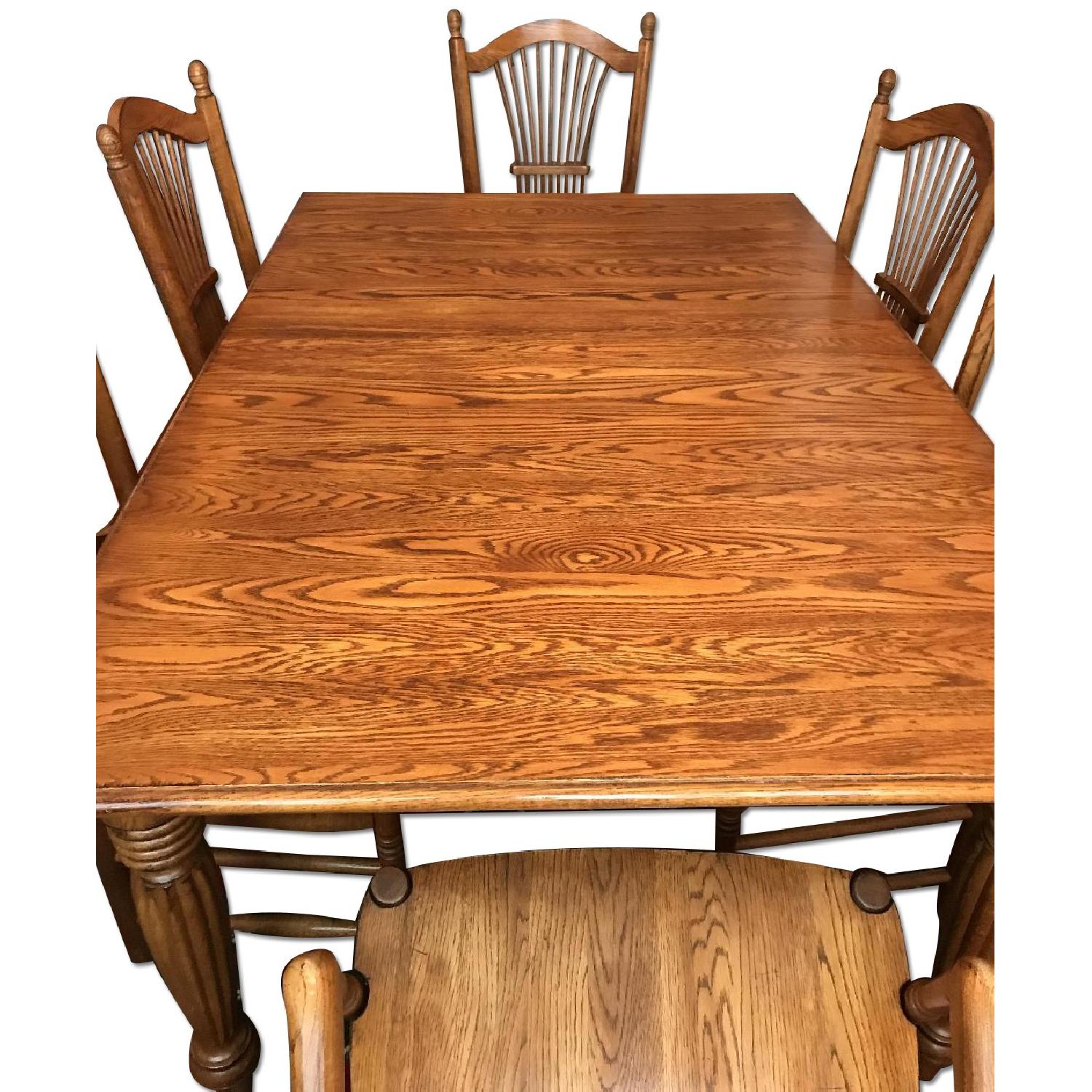 Solid Oak Dining Table w/ 6 Solid Oak Dining Chairs - AptDeco