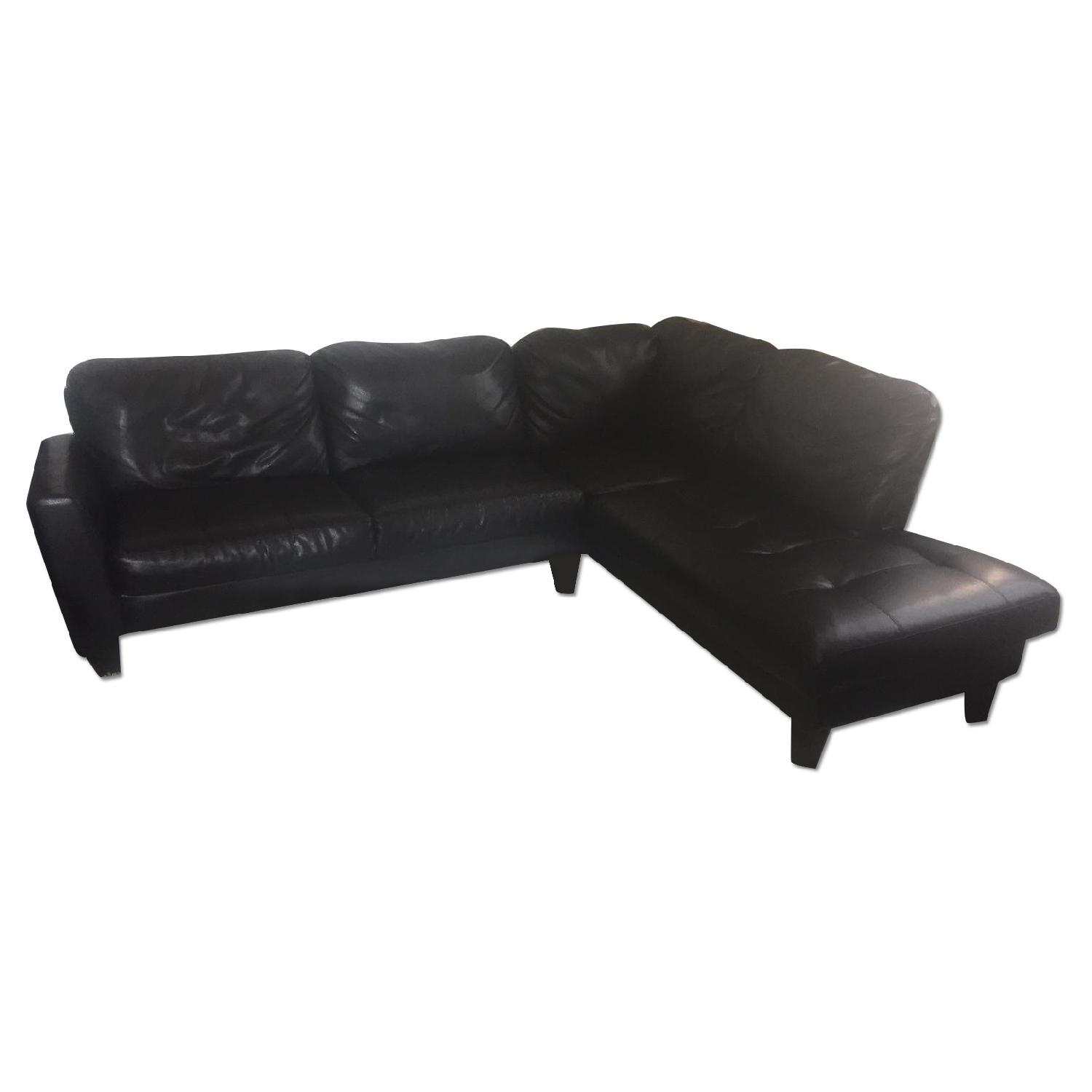 Jennifer Convertible Bonded Leather Sectional Sofa & Ottoman AptDeco