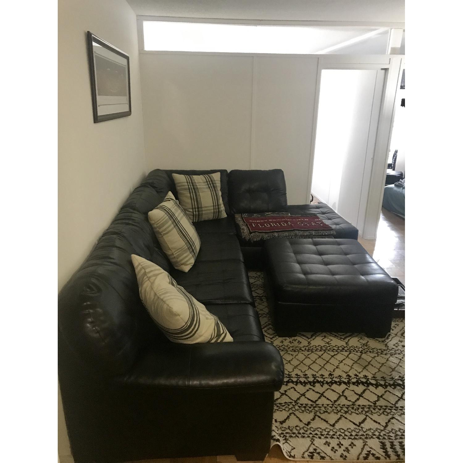 Rooms To Go Black Leather Sectional Couch - image-3