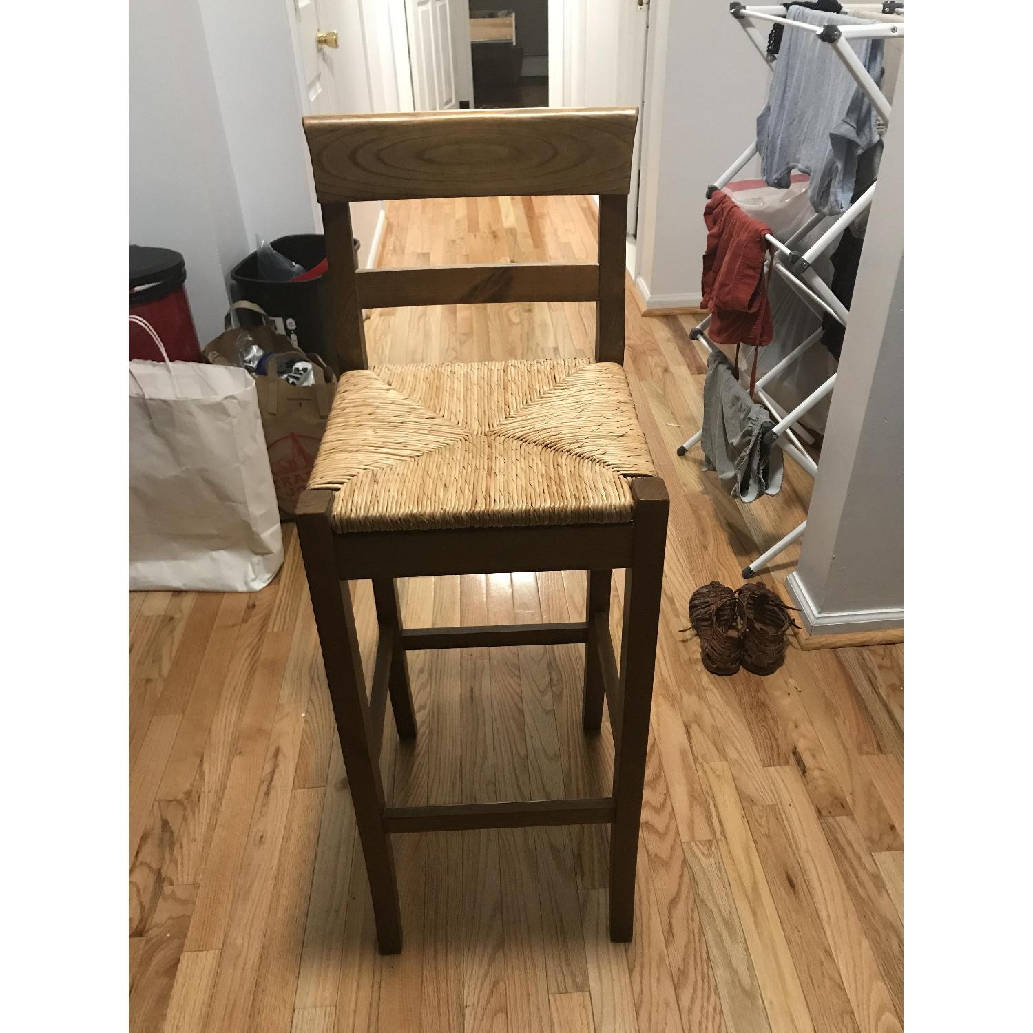 Pier 1 Brown Wooden Bar Stool w/ Woven Seat - image-1
