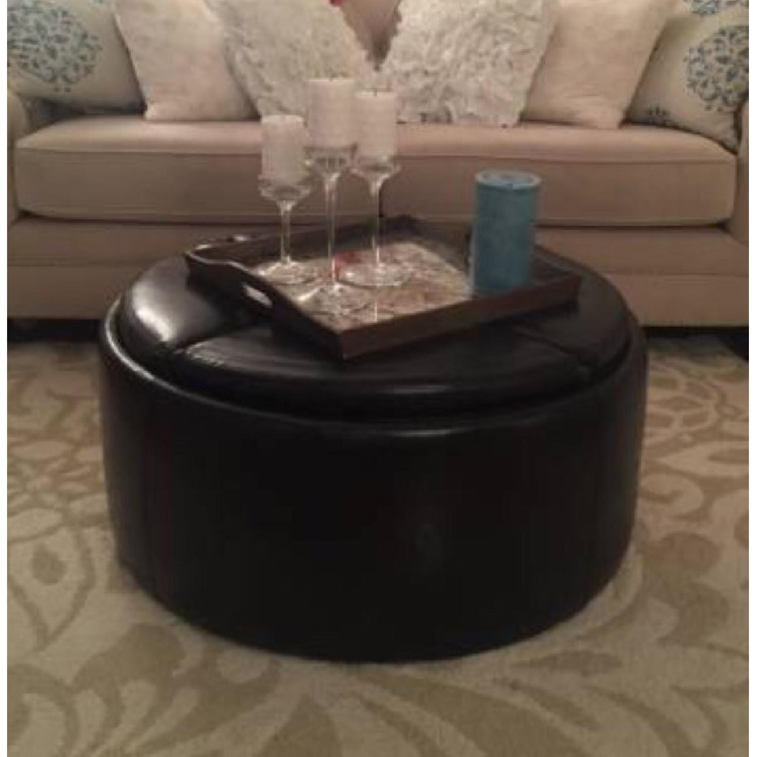 Raymour & Flanigan Black Leather Coffee Table/Ottoman AptDeco