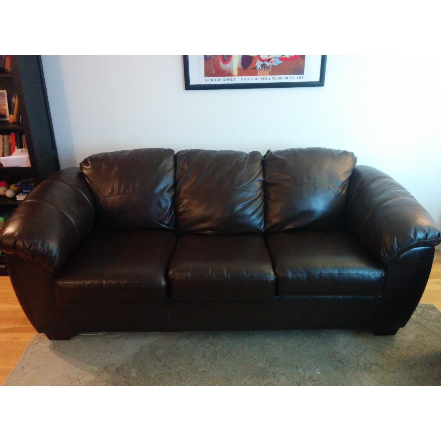 Ashley's Brown Durablend Sofa - image-1