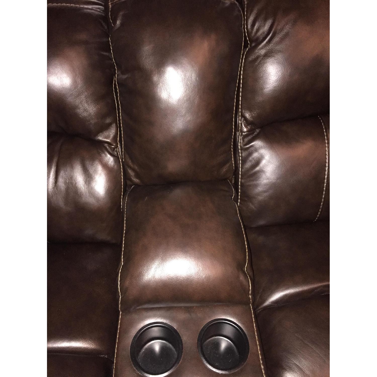 Ashley's Damacio 3 Piece Power Recliner Sectional w/ Chaise - image-1