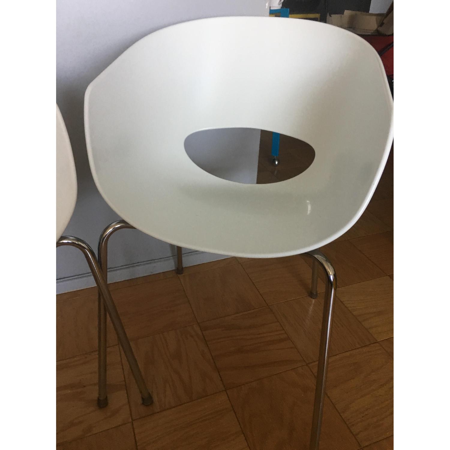 CB2 Orbit white Arm Chairs - image-1