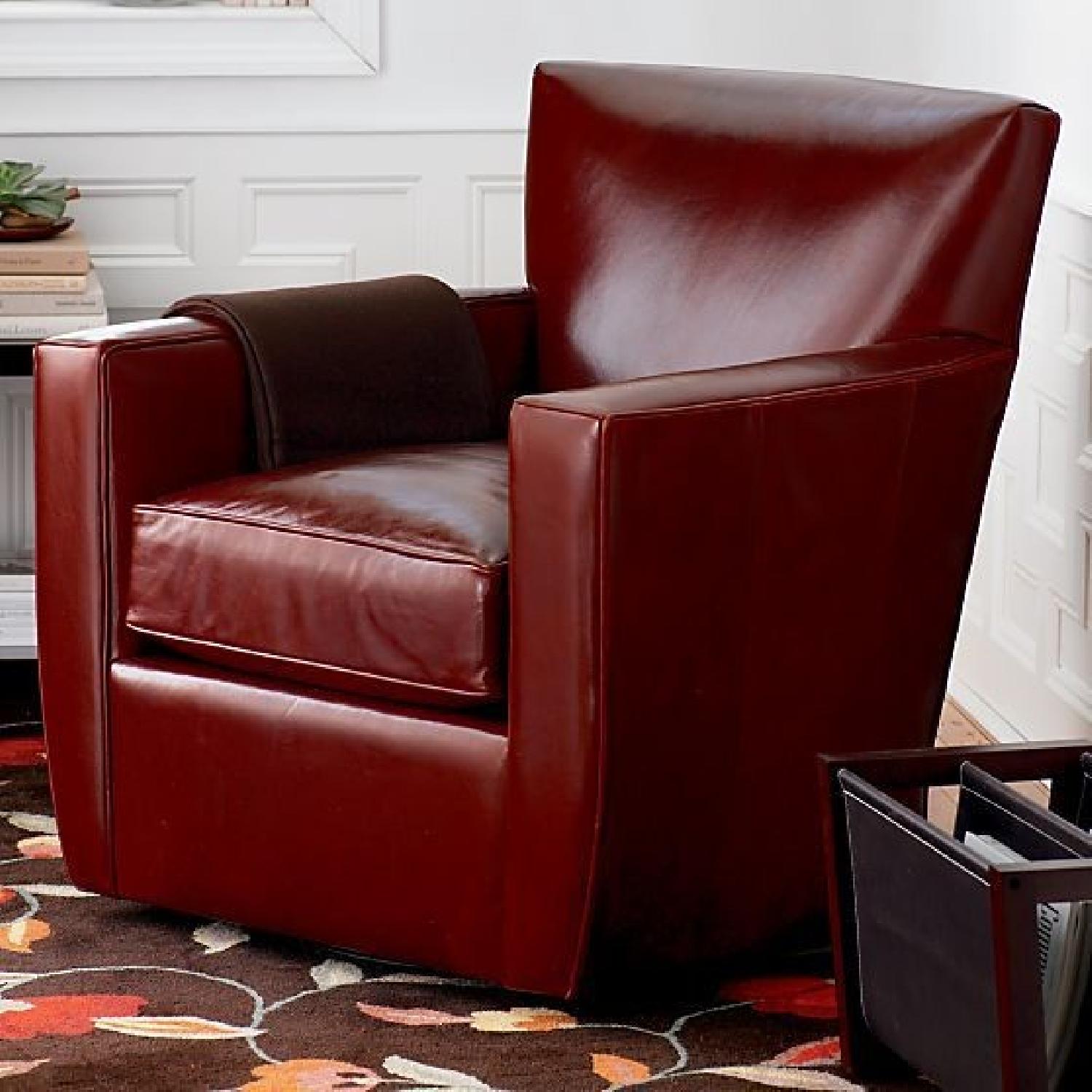 Crate & Barrel Red Leather Swivel Armchair AptDeco