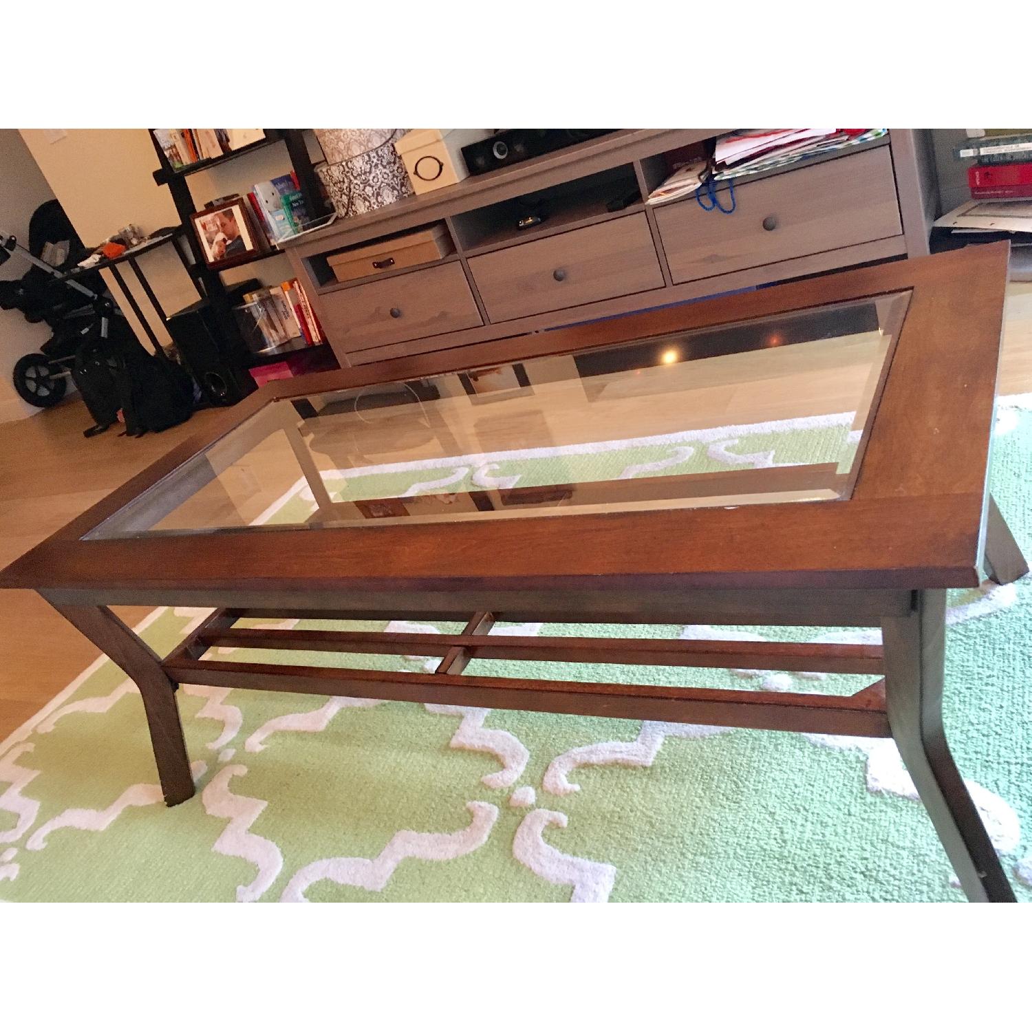 Klaussner Furniture Glass Top Dark Wood Coffee Table - image-1
