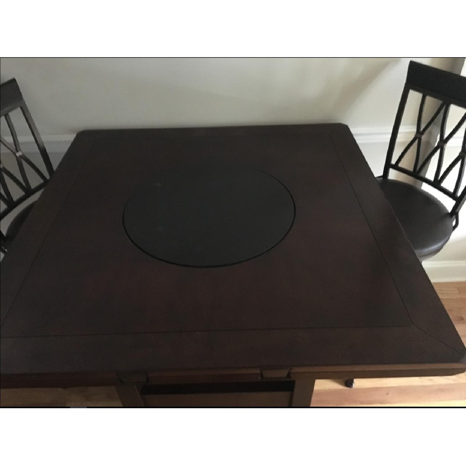 Raymour & Flanigan Zahara Round Dining Table w/ Drop Leaf AptDeco