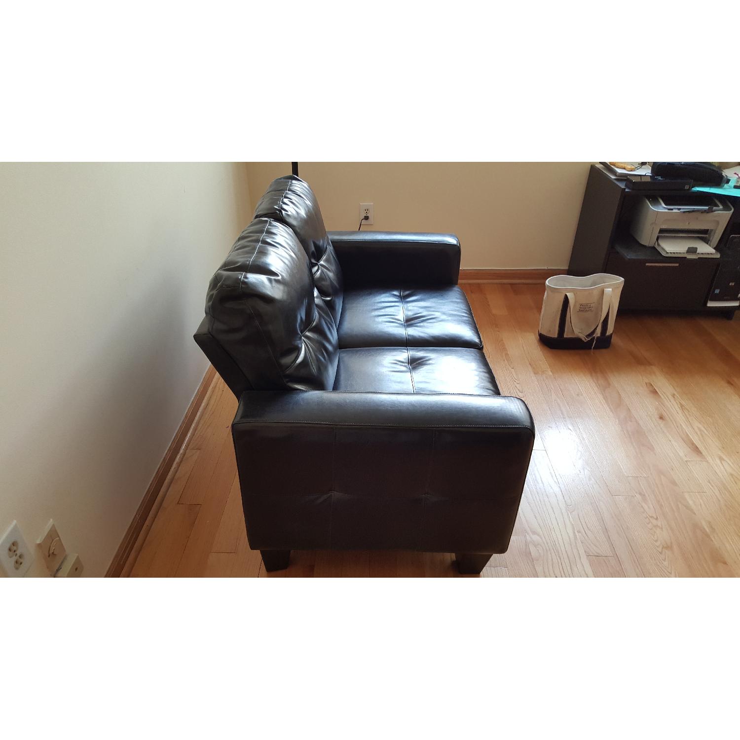 Jennifer Convertible Black Faux Leather Loveseat - image-2