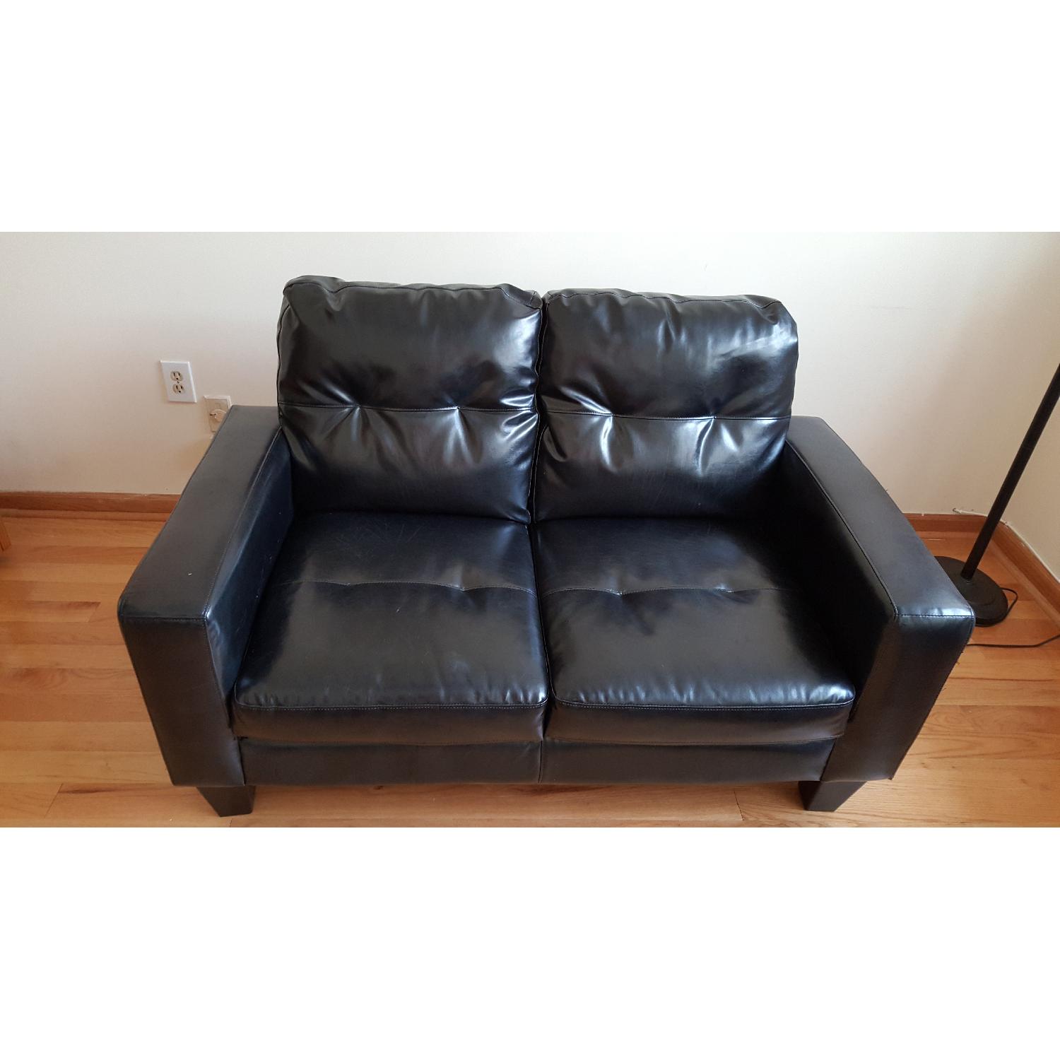Jennifer Convertible Black Faux Leather Loveseat - image-3