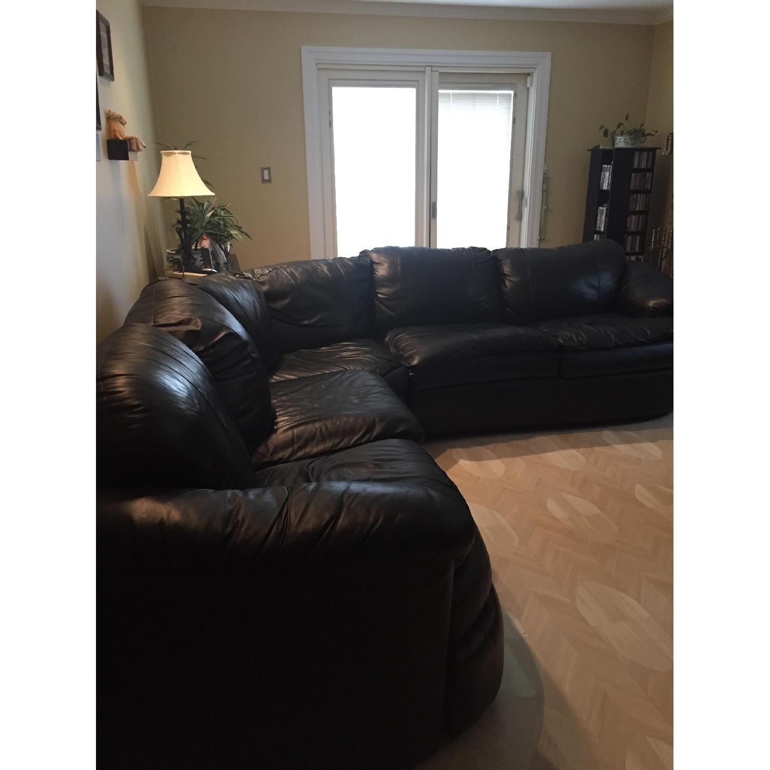 Black Leather Sectional w/ Full Size Pull Out Bed - image-1