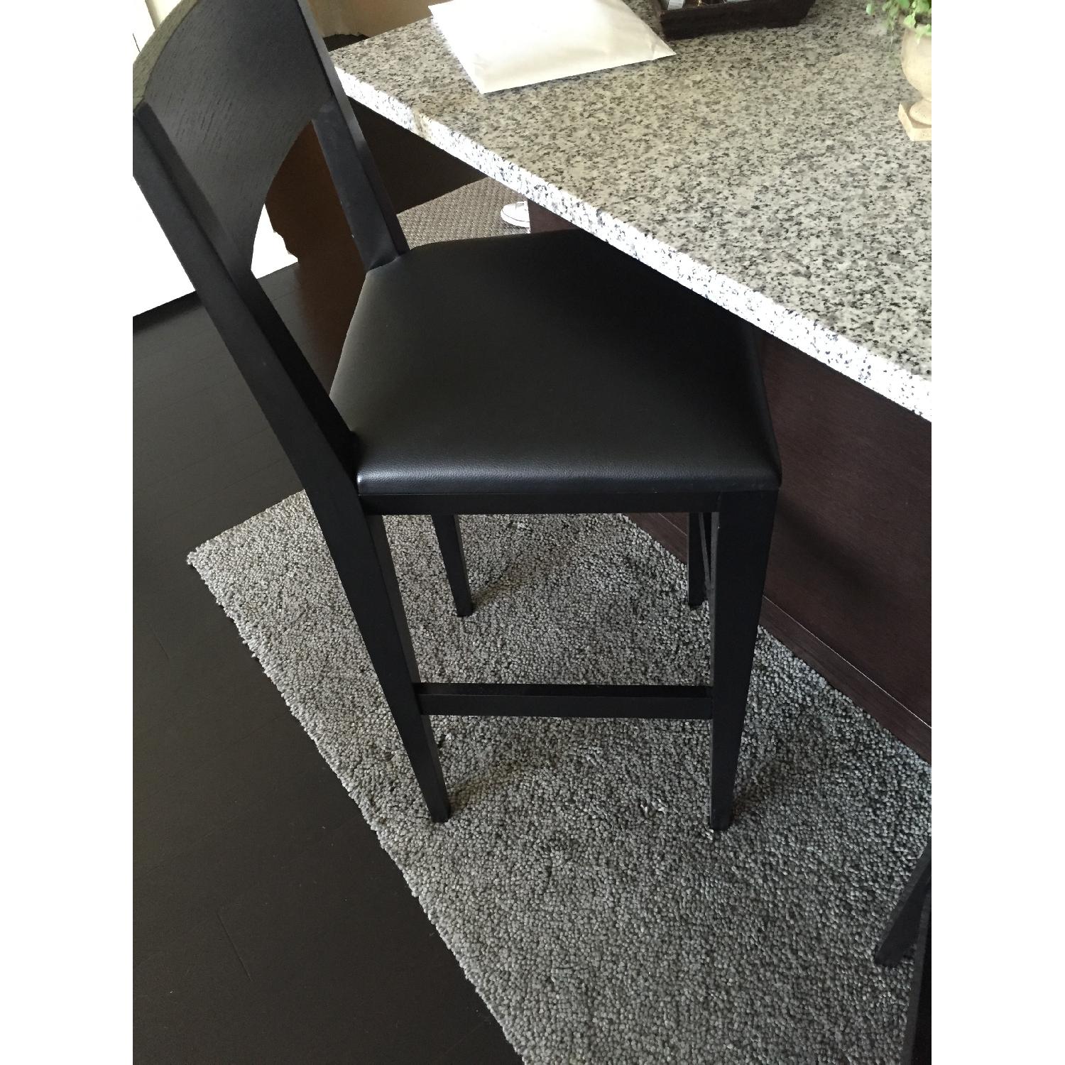 Crate & Barrel Black Leather Bar Stools - Pair - image-1