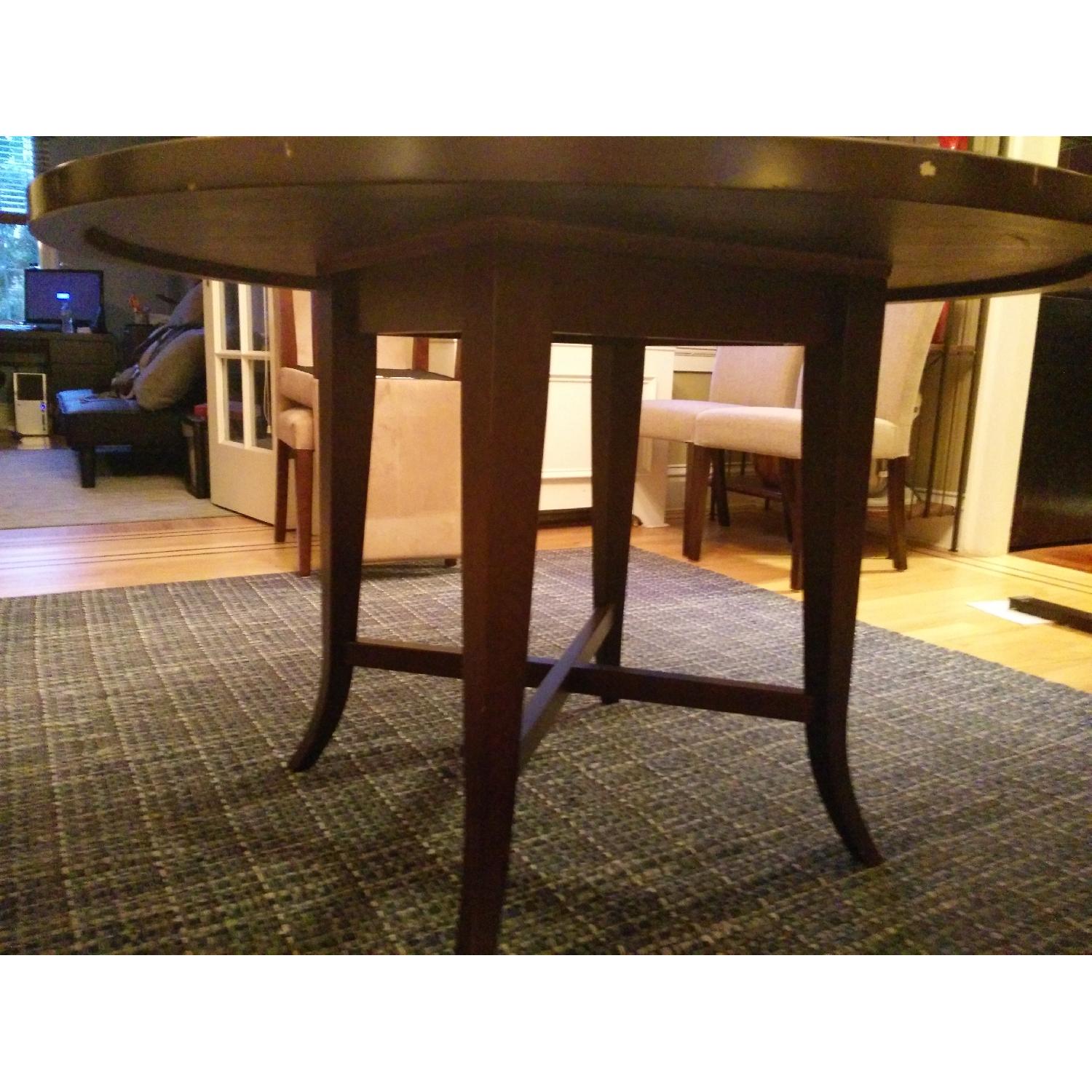 Crate & Barrel Round Dining Table in Espresso - AptDeco