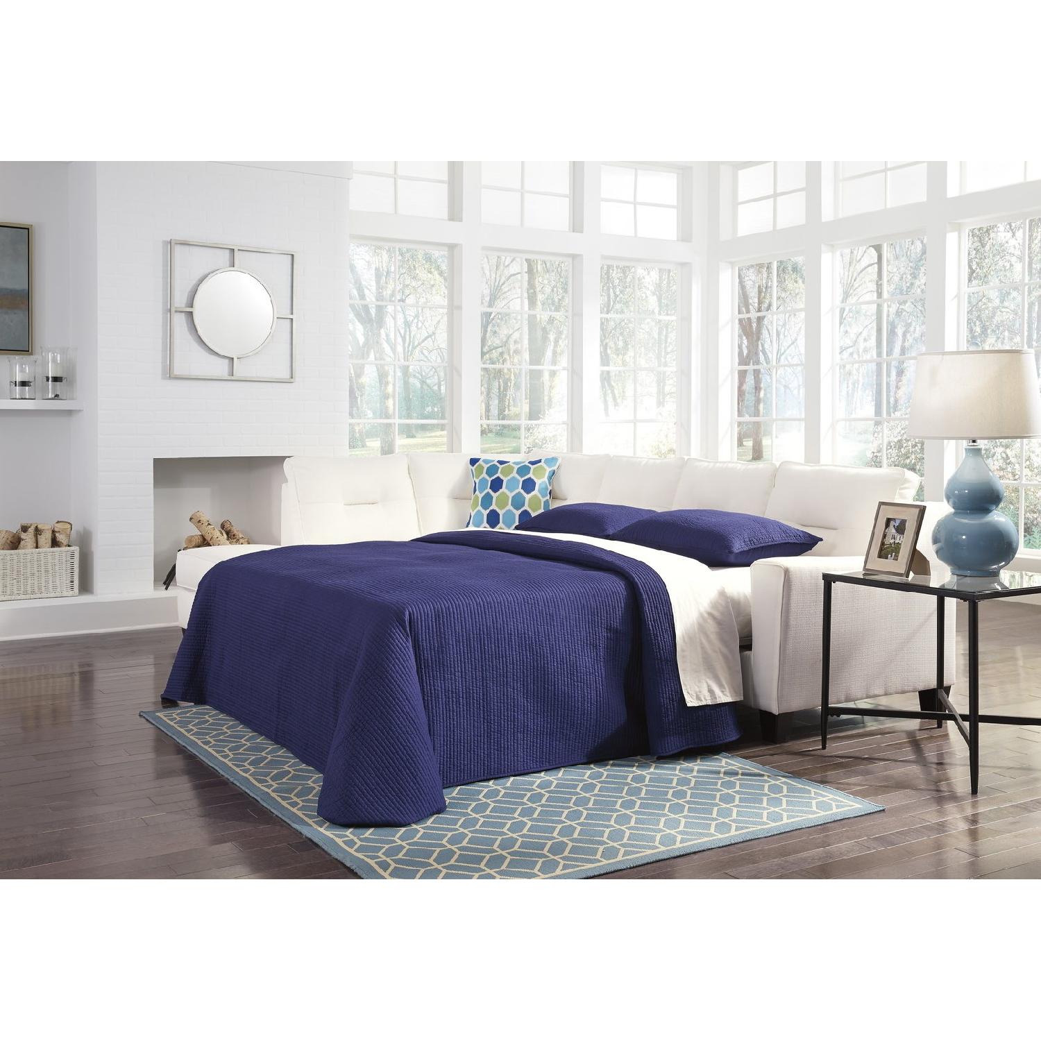 Ashley's Kirwin Nuvella Queen Sleeper Sectional Sofa - image-1