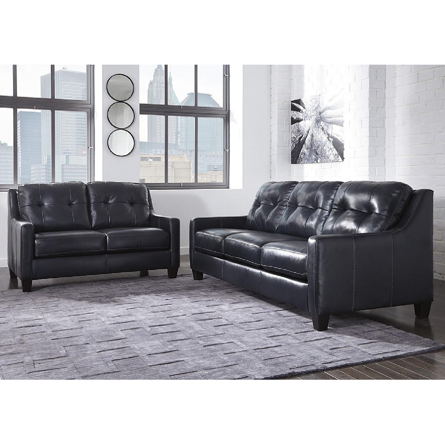 Ashley's O'Kean Sleeper Sofa in Navy - image-1