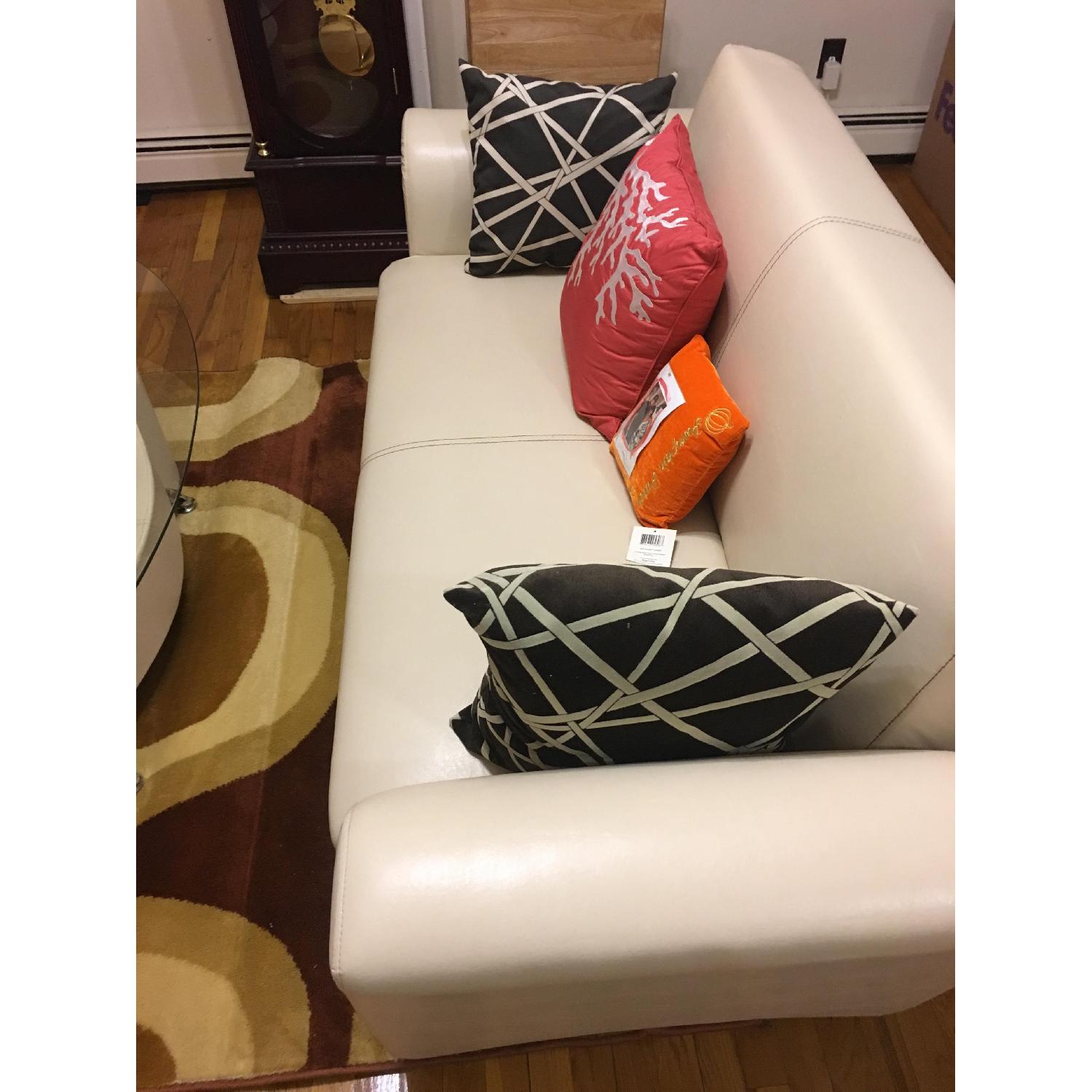 Ashley's Leather Loveseat - image-0