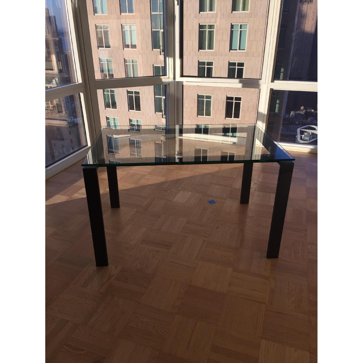 Room & Board Glass Top Dining Table w/ Black Metal Frame AptDeco