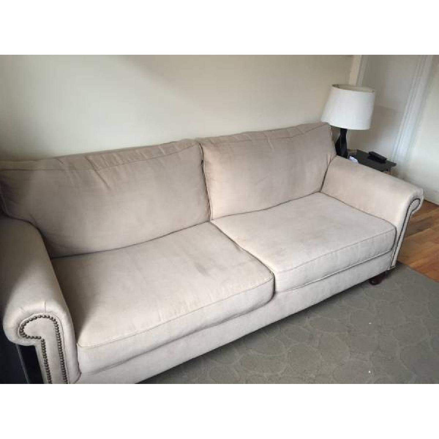 Pier 1 Beige Sofa w/ Nailhead Detail AptDeco