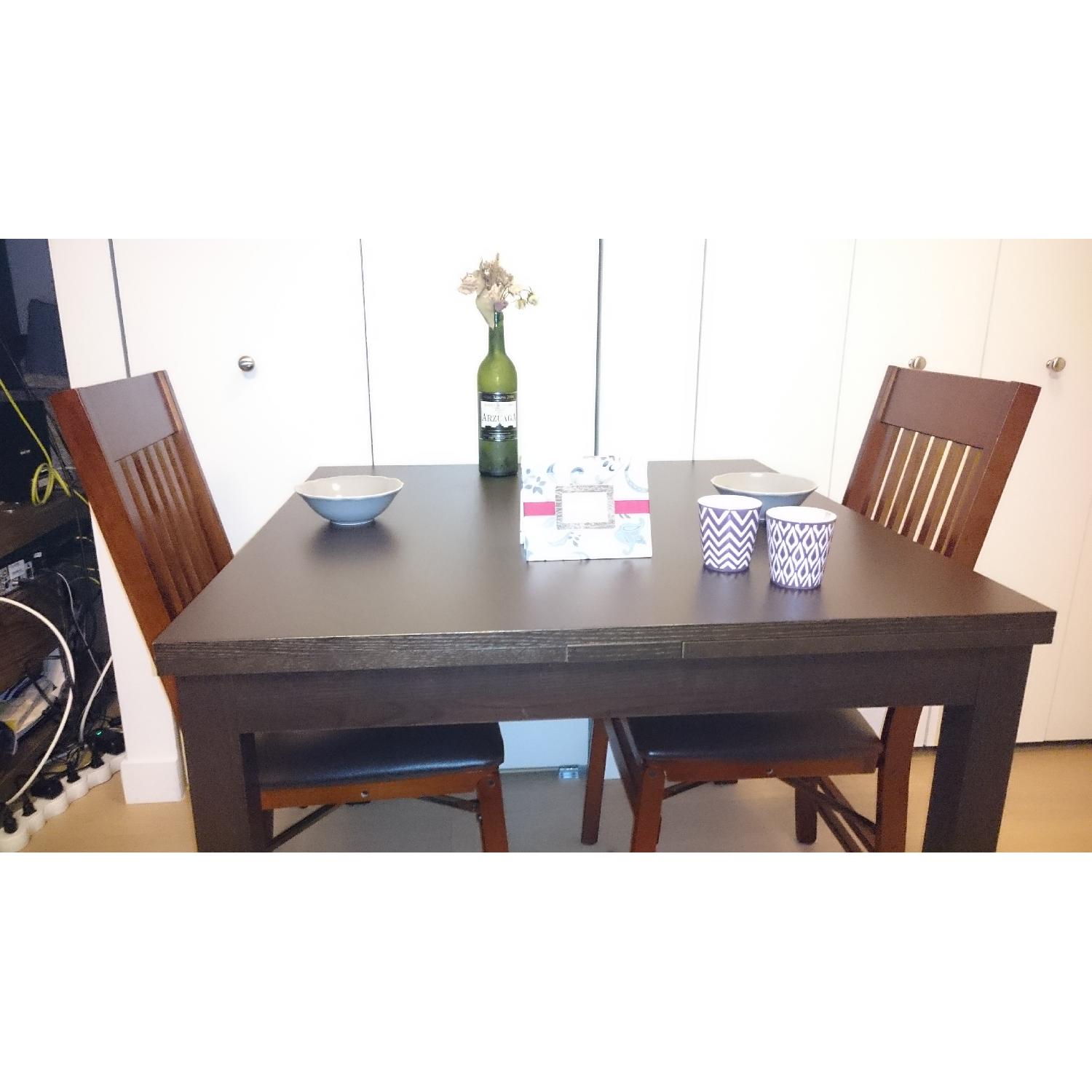 IKEA BJURSTA ビュースター ダイニングテーブル ダークブラウン Ikea Bjursta Black-Brown Extendable Dining Table - AptDeco