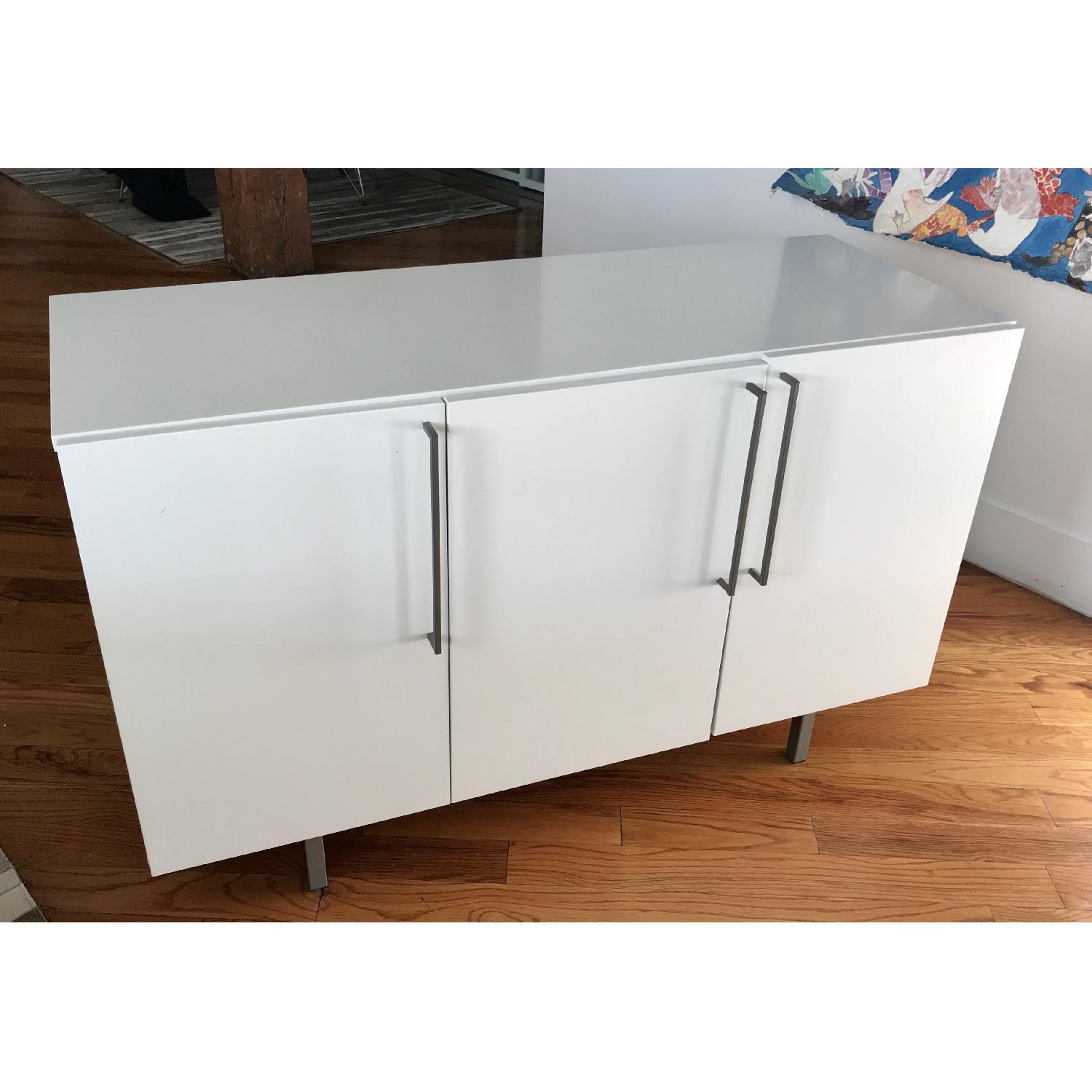 CB2 White 3Door w/ Stainless Steel Legs & Handles AptDeco
