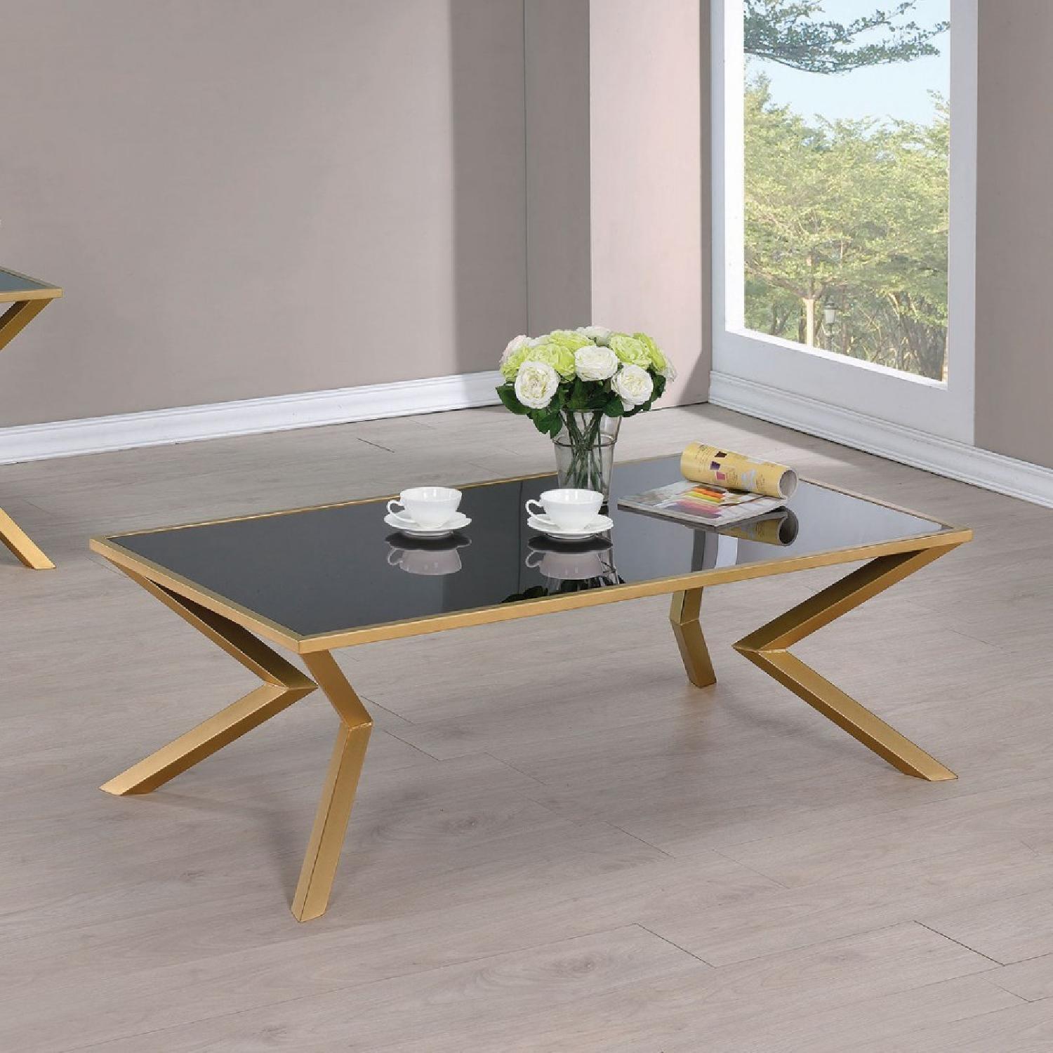Black Glass Top Coffee Table with Brushed Brass Legs - image-1