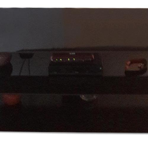 Used Amber & Black TV Stand for sale on AptDeco