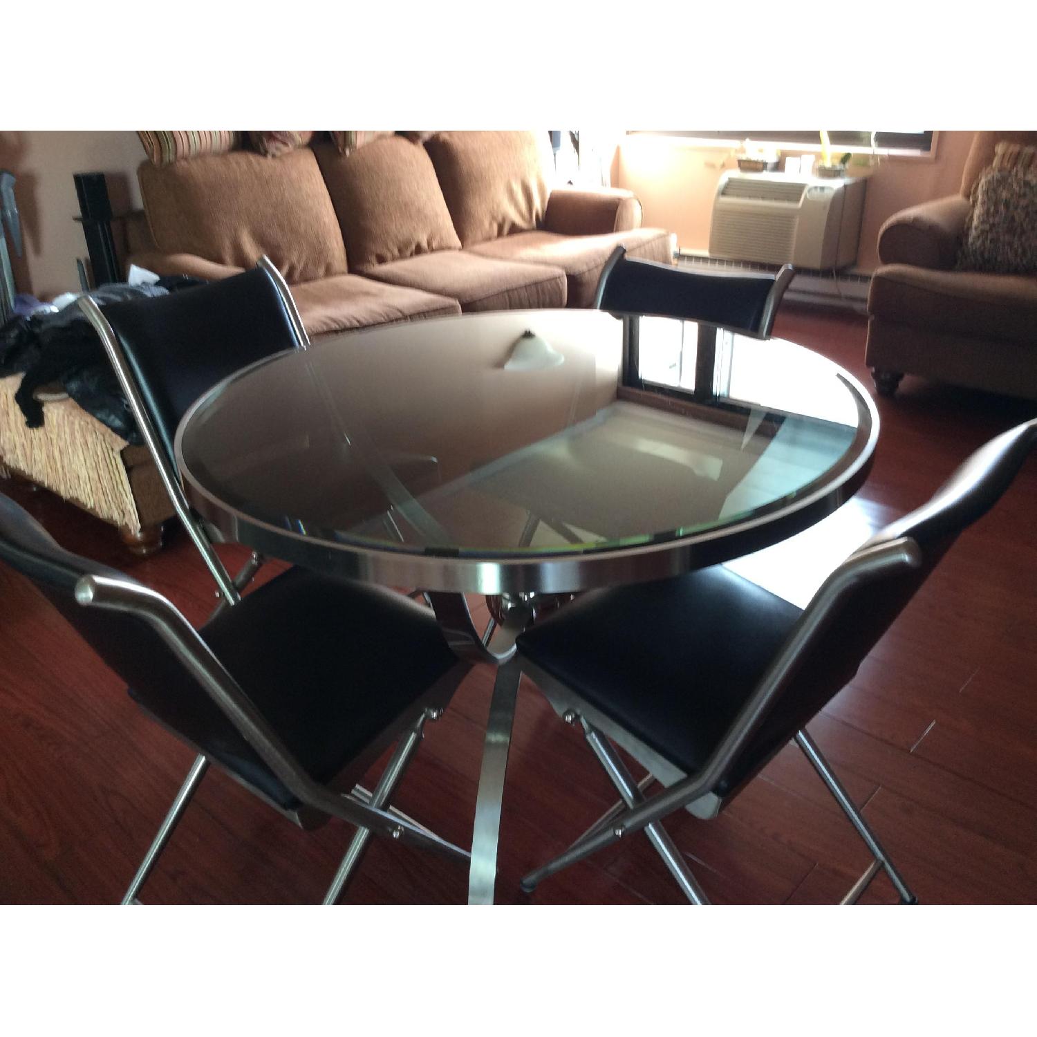 Bloomingdale's Sphere Dining Table w/ 4 Black Leather Chairs AptDeco