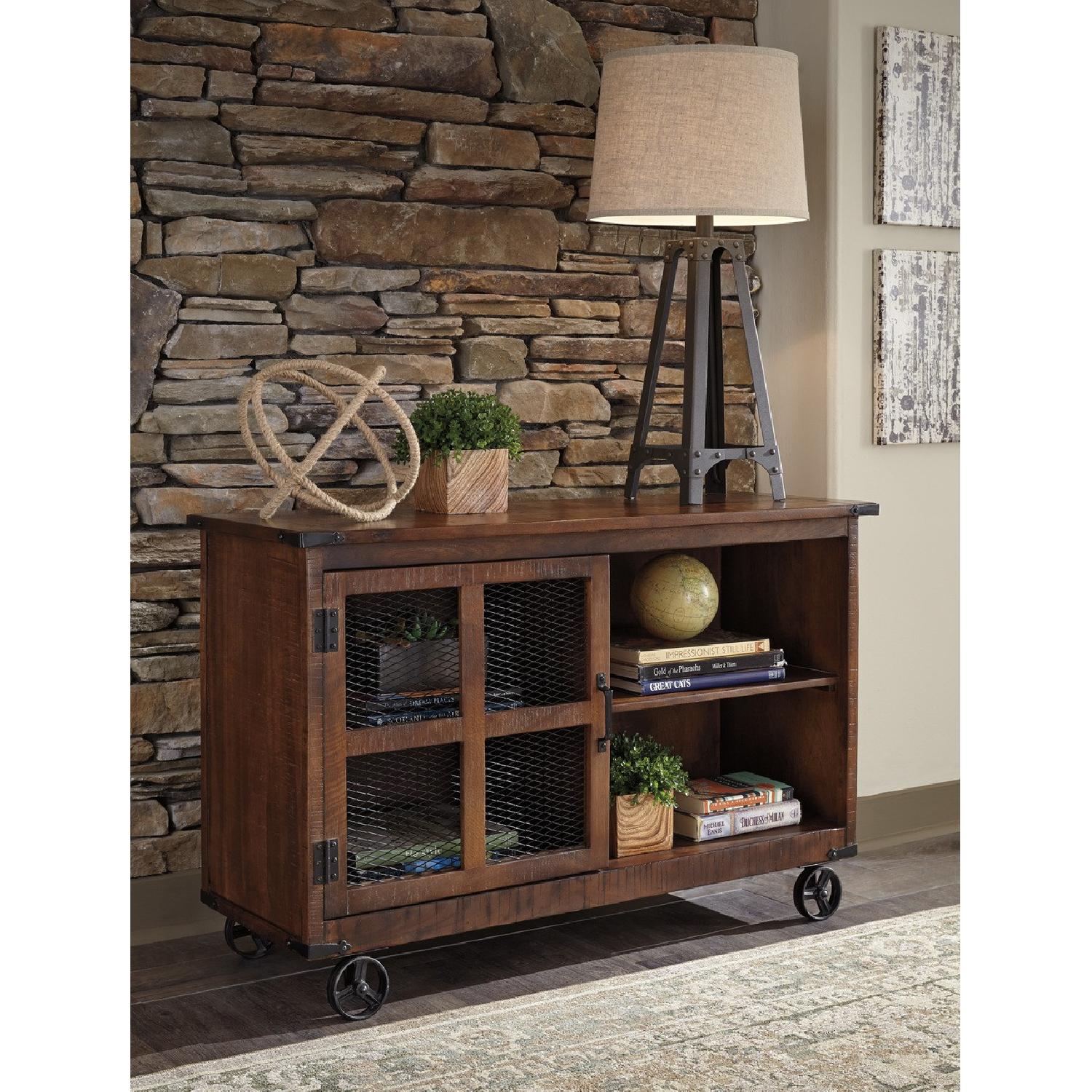 Ashley Furniture Norlandon Medium Brown Console - image-1