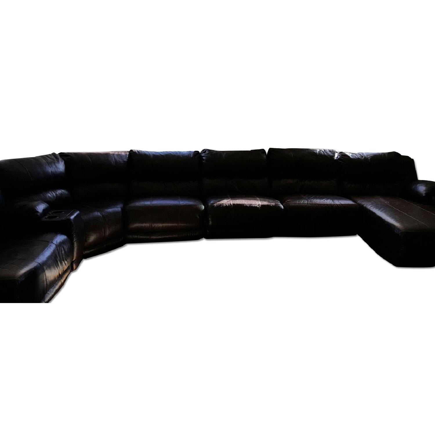 Ashley's Extended Leather Sectional with Left Arm Lounger - image-0