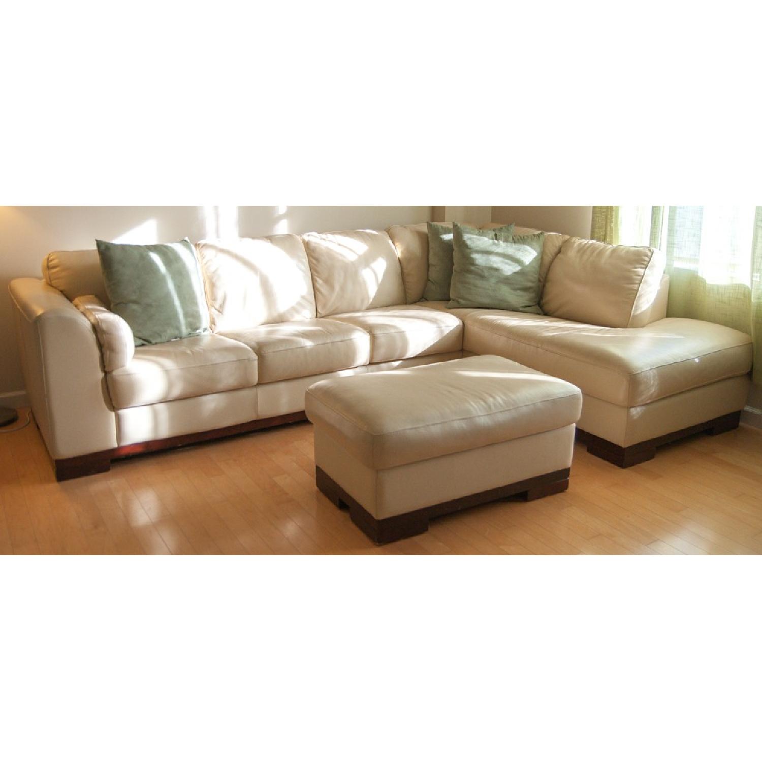 Jordan's Leather Sectional Couch w/ Storage Ottoman - image-1