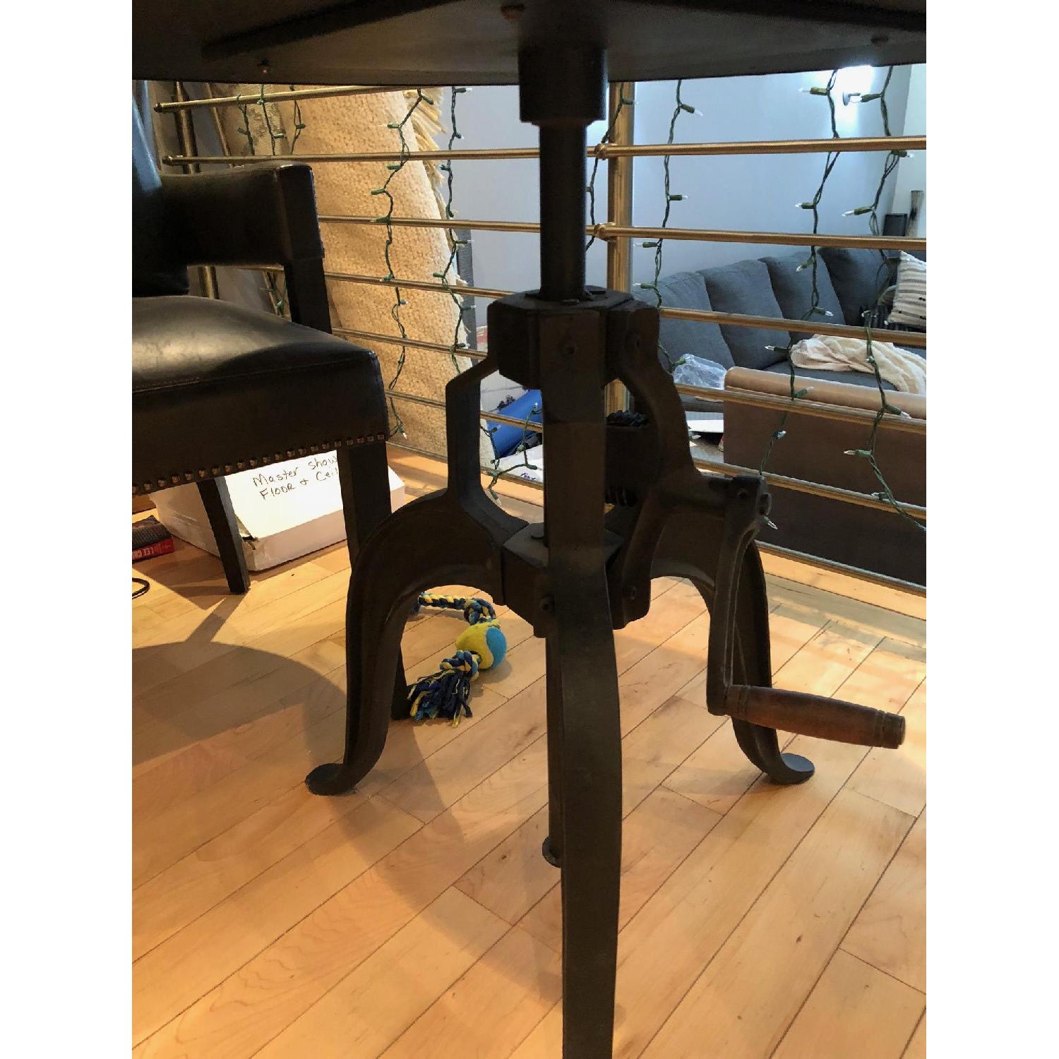 Arhaus Hammered Zinc Alloy Top Dining Table w/ Edison Base AptDeco