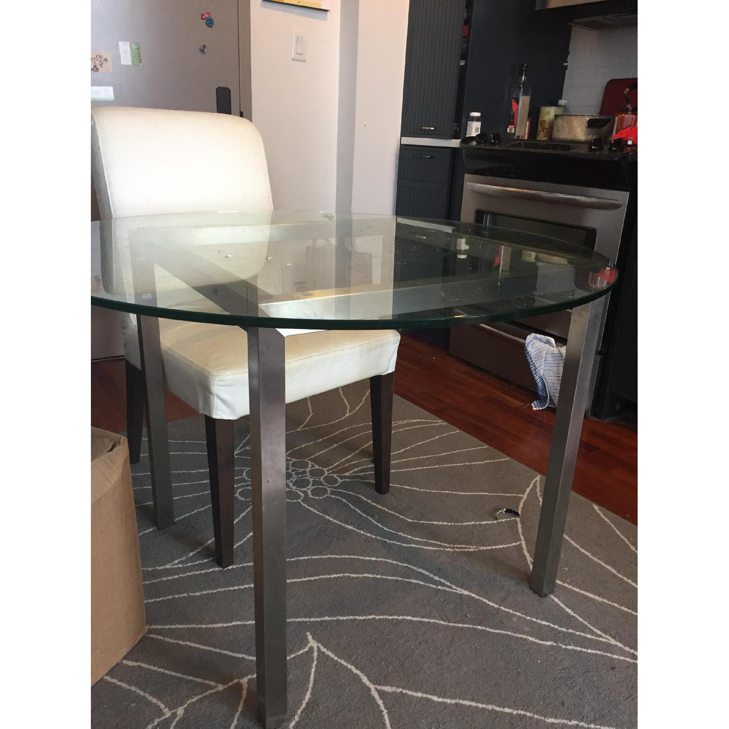 Bloomingdale's Round Glass Dining Table w/ 2 Ikea Chairs AptDeco