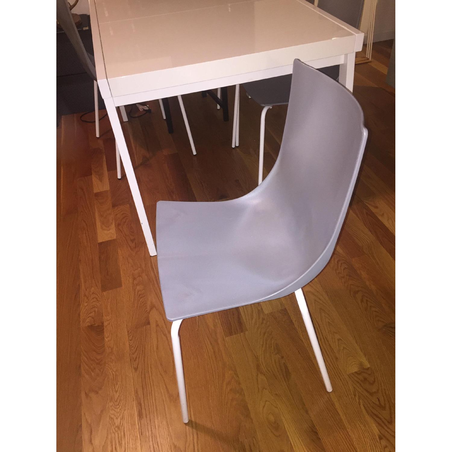 CB2 White Extendable Dining Table AptDeco