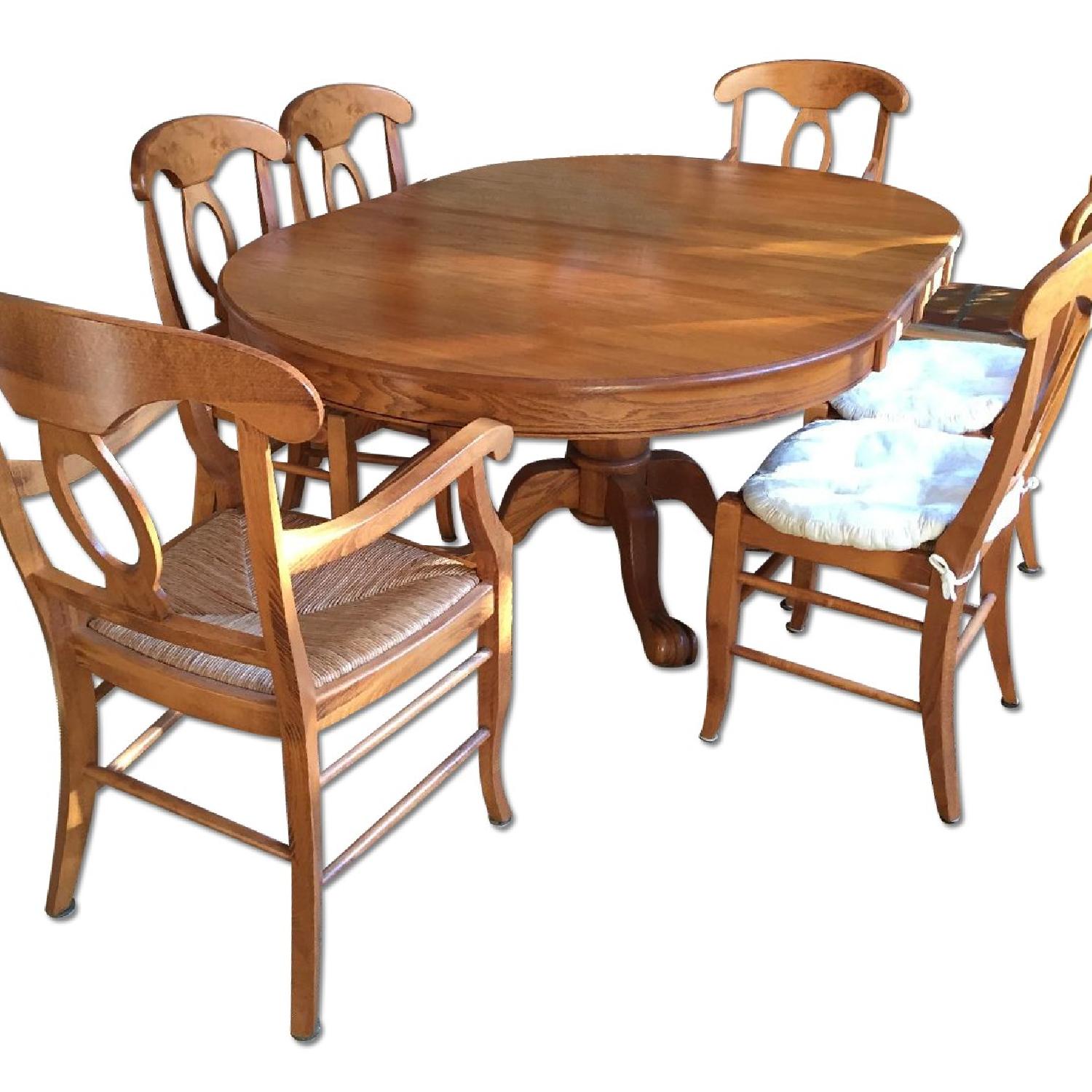 Oak Pedestal Dining Table w/ 6 Pottery Barn Chairs AptDeco