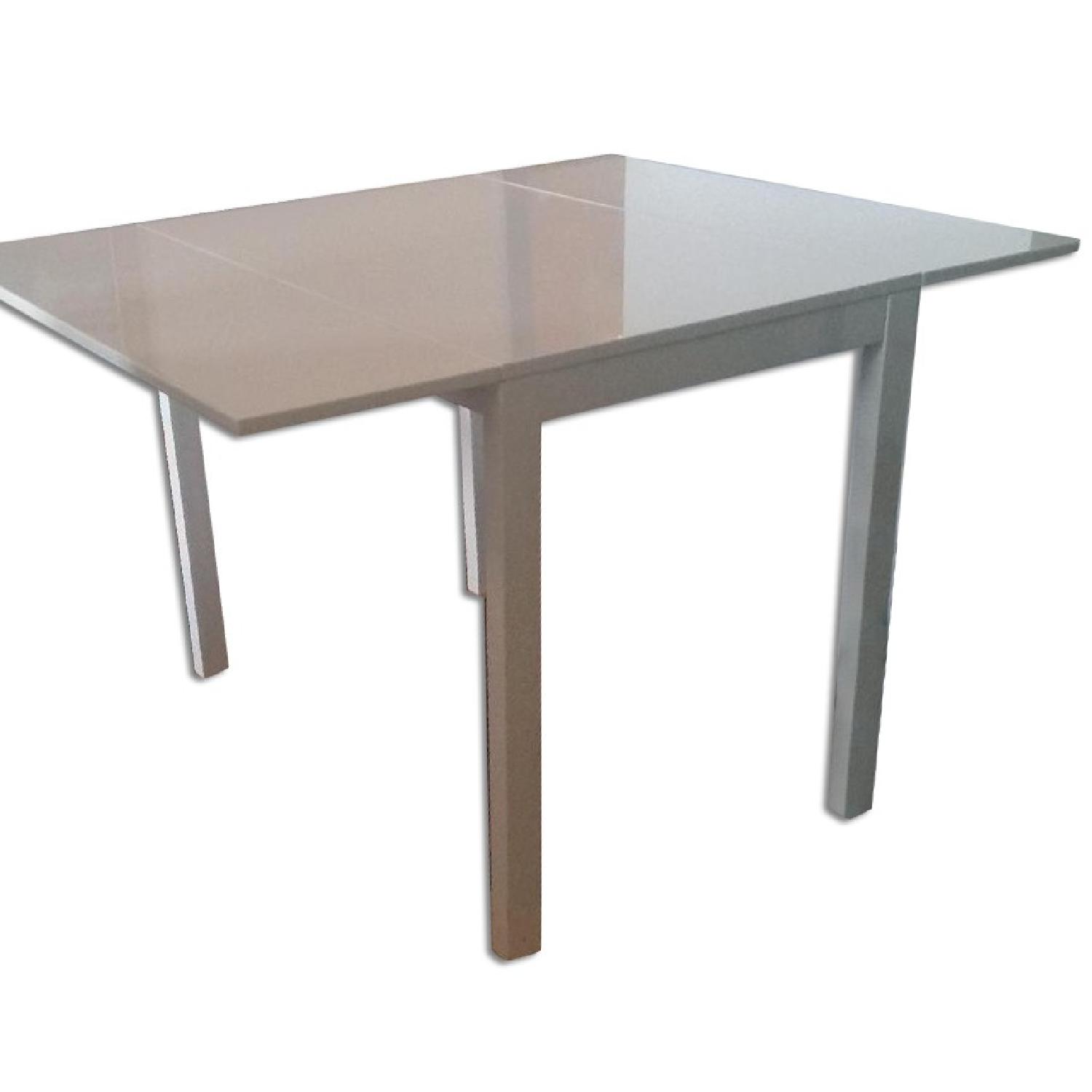 CB2 Gloss White Drop Leaf Table - image-0