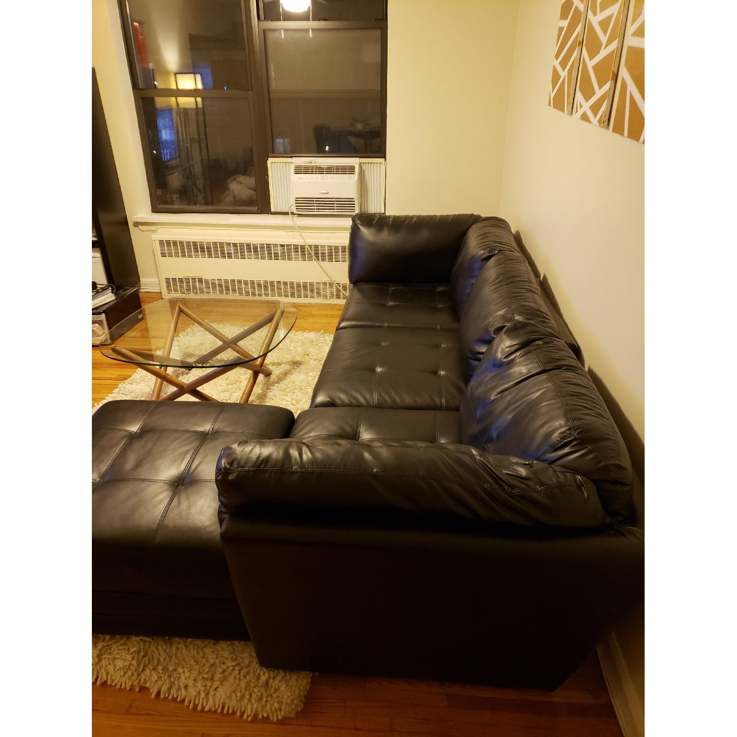 Bob's Black Leather Sectional Couch AptDeco