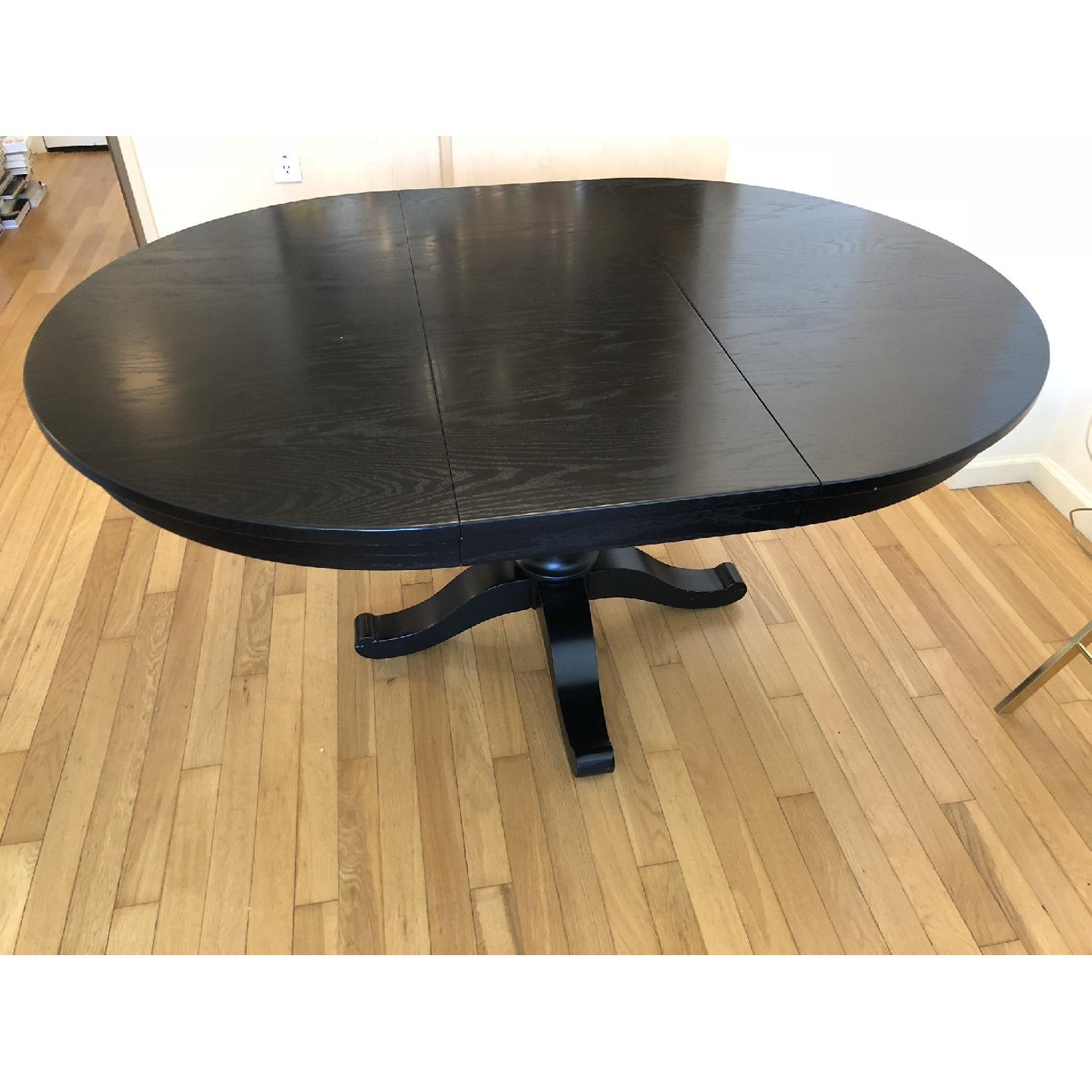 Crate & Barrel Avalon Black Round Extension Dining Table AptDeco