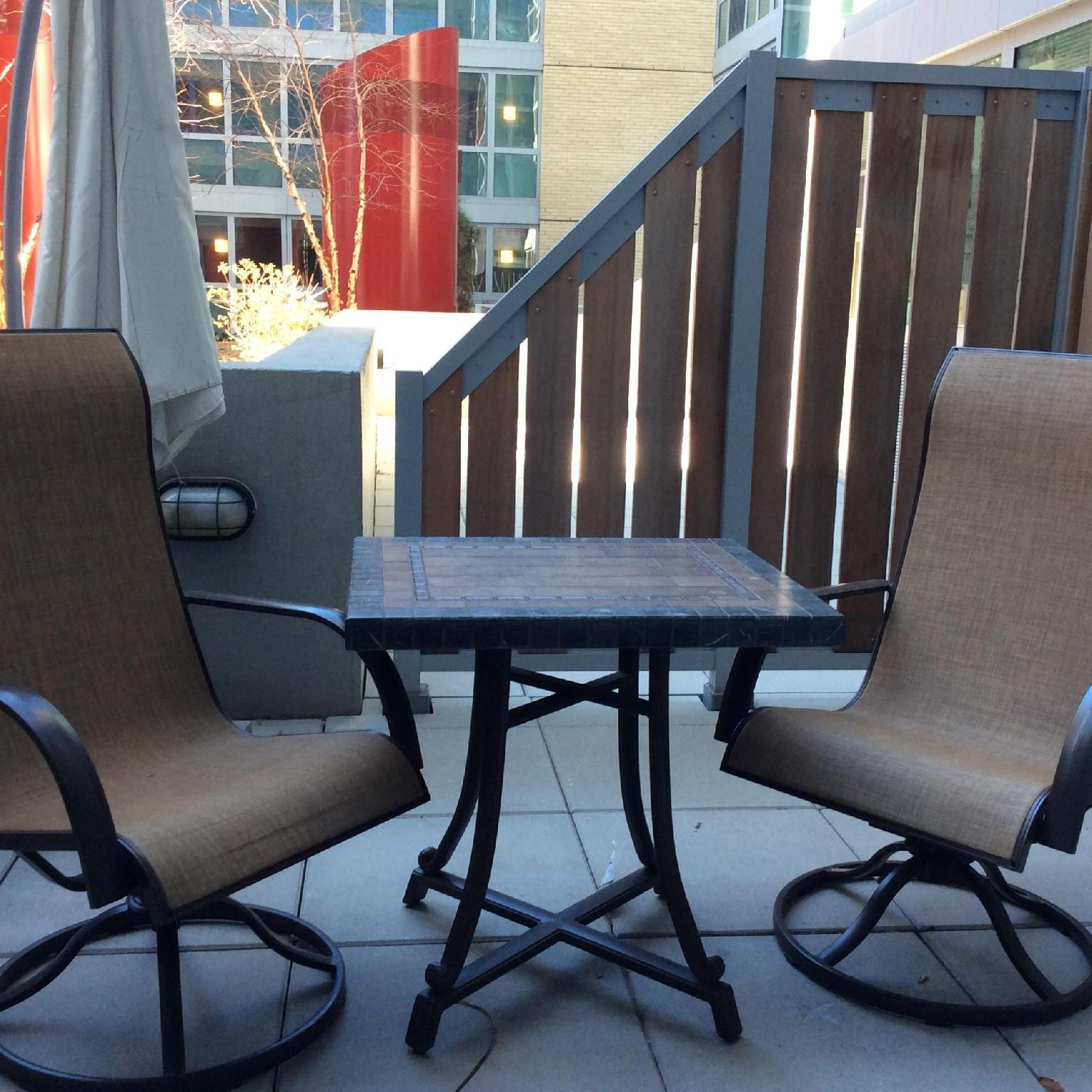 Outdoor Patio Table w/ 2 Swivel Chairs + Umbrella - image-1