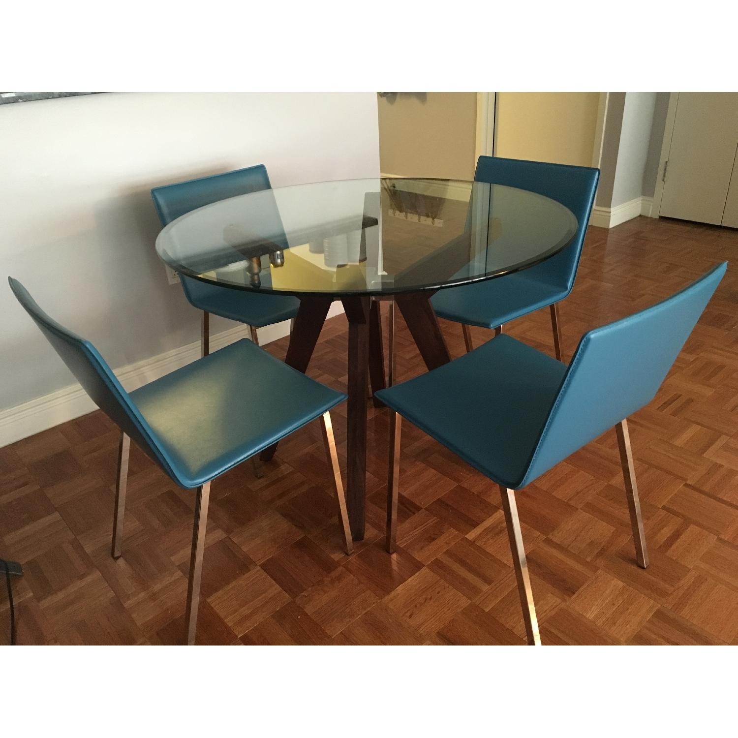 Crate & Barrel Strut Glass Dining Table AptDeco
